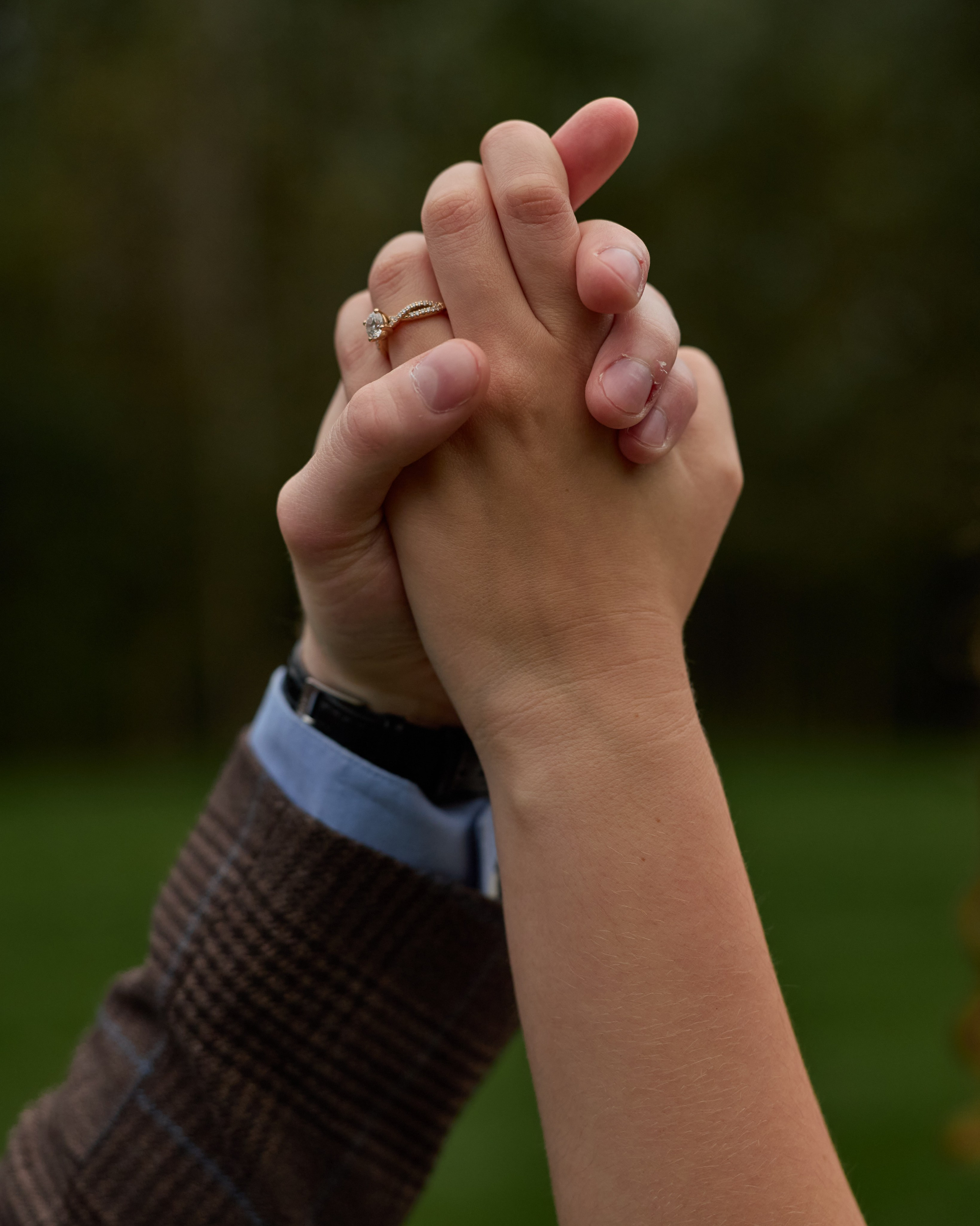 Clasped hands showing the engagement ring at Swan Lake Event Center, Ohio