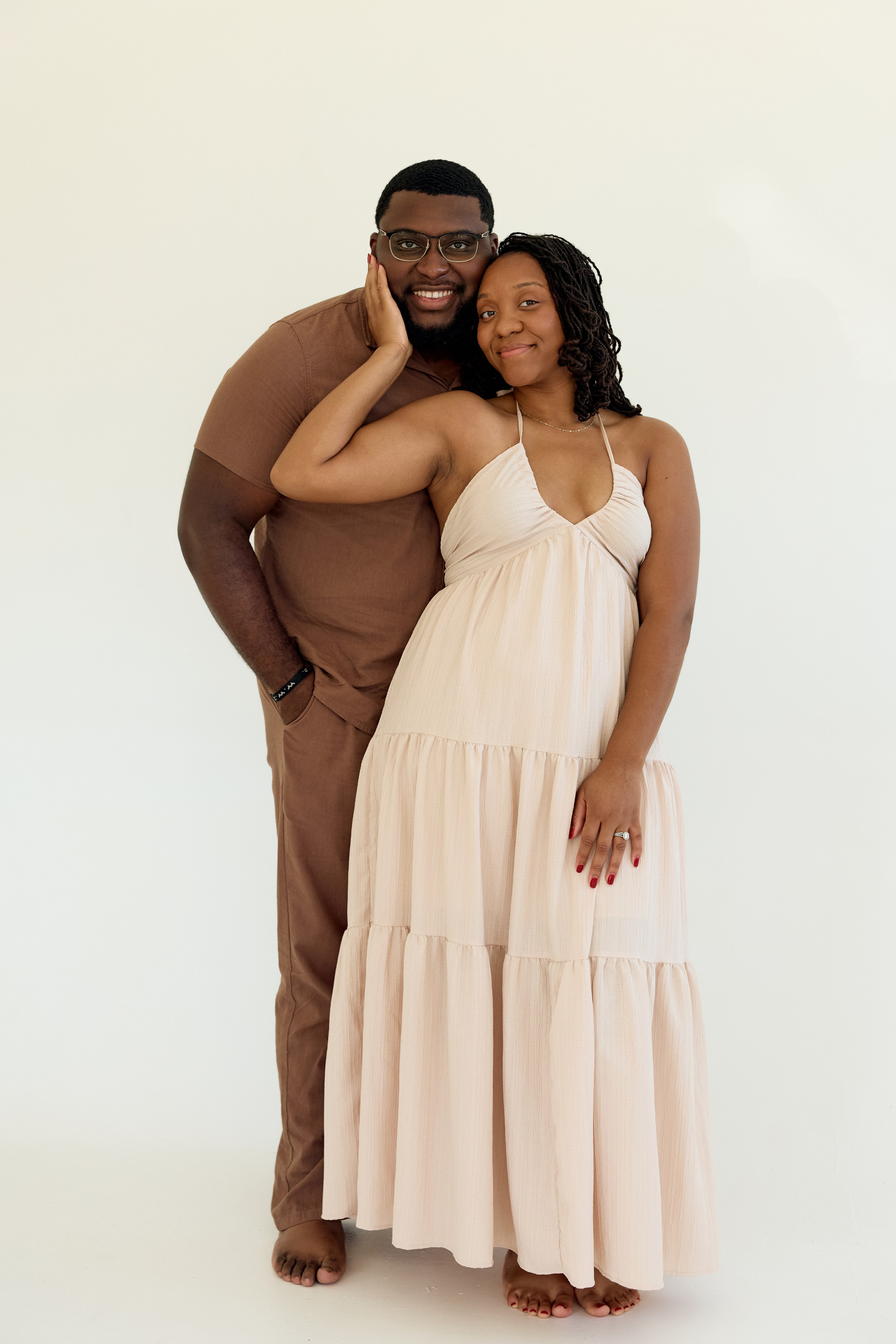  Standing together before a white seamless backdrop in a Columbus studio