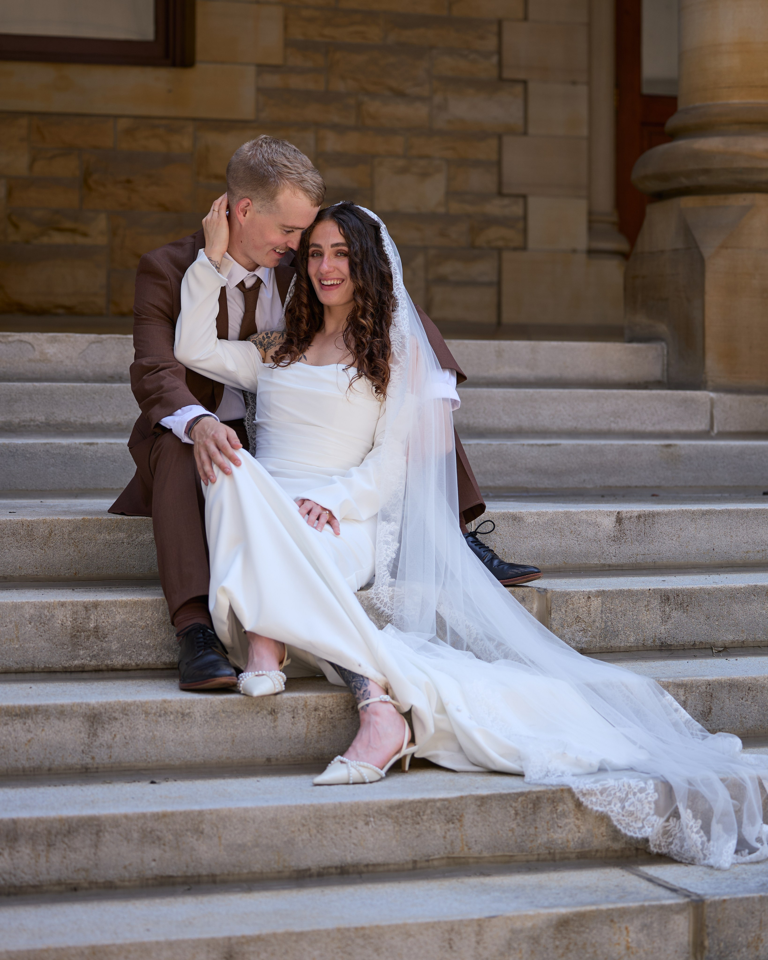Seated embrace on the steps of 100 S 3rd Street, Columbus Ohio