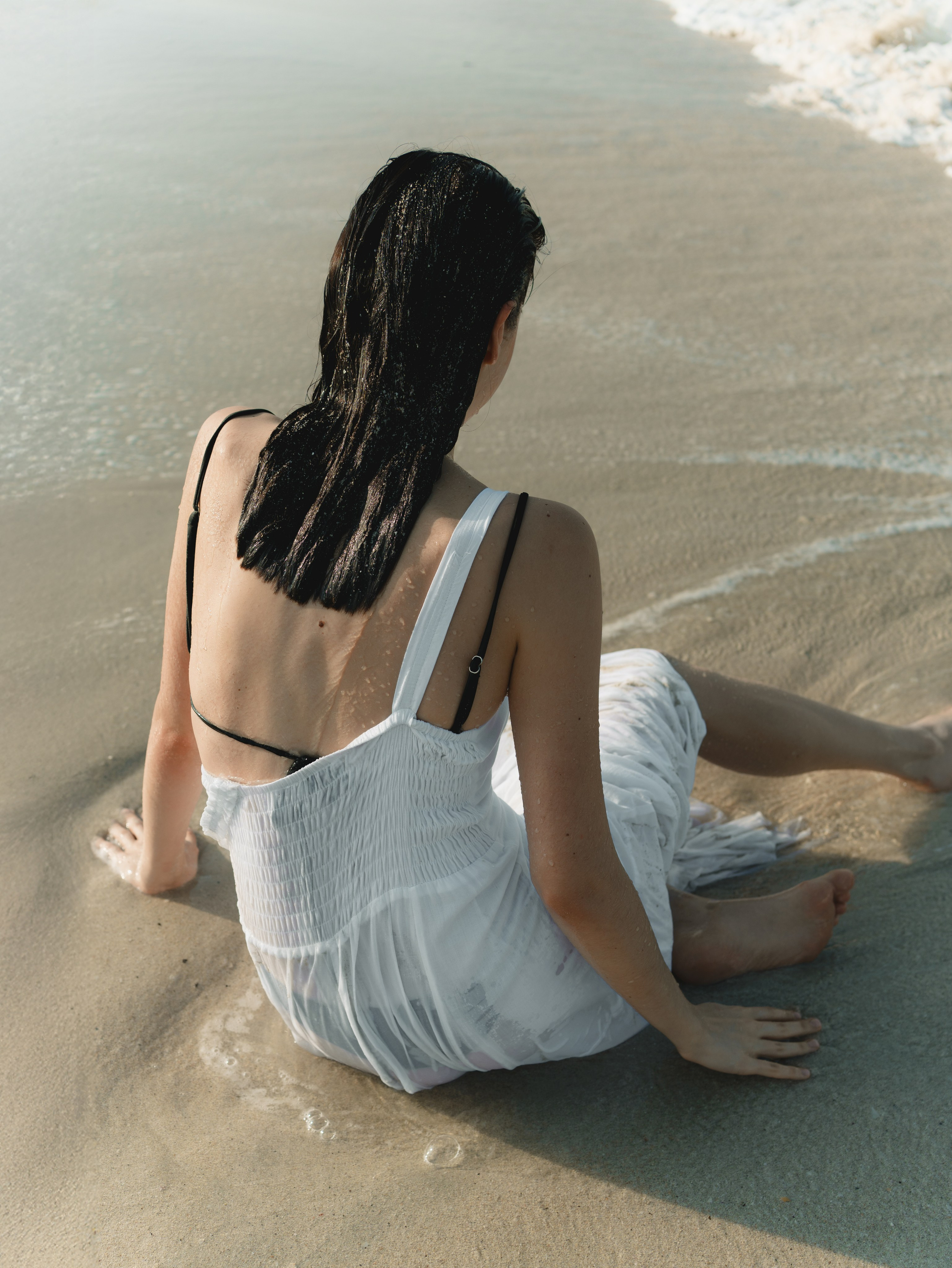 Fashion portrait series on the beach in minimalistic swimwear look. Alisha Geva | Contemporary fashion women’s portrait Dubai