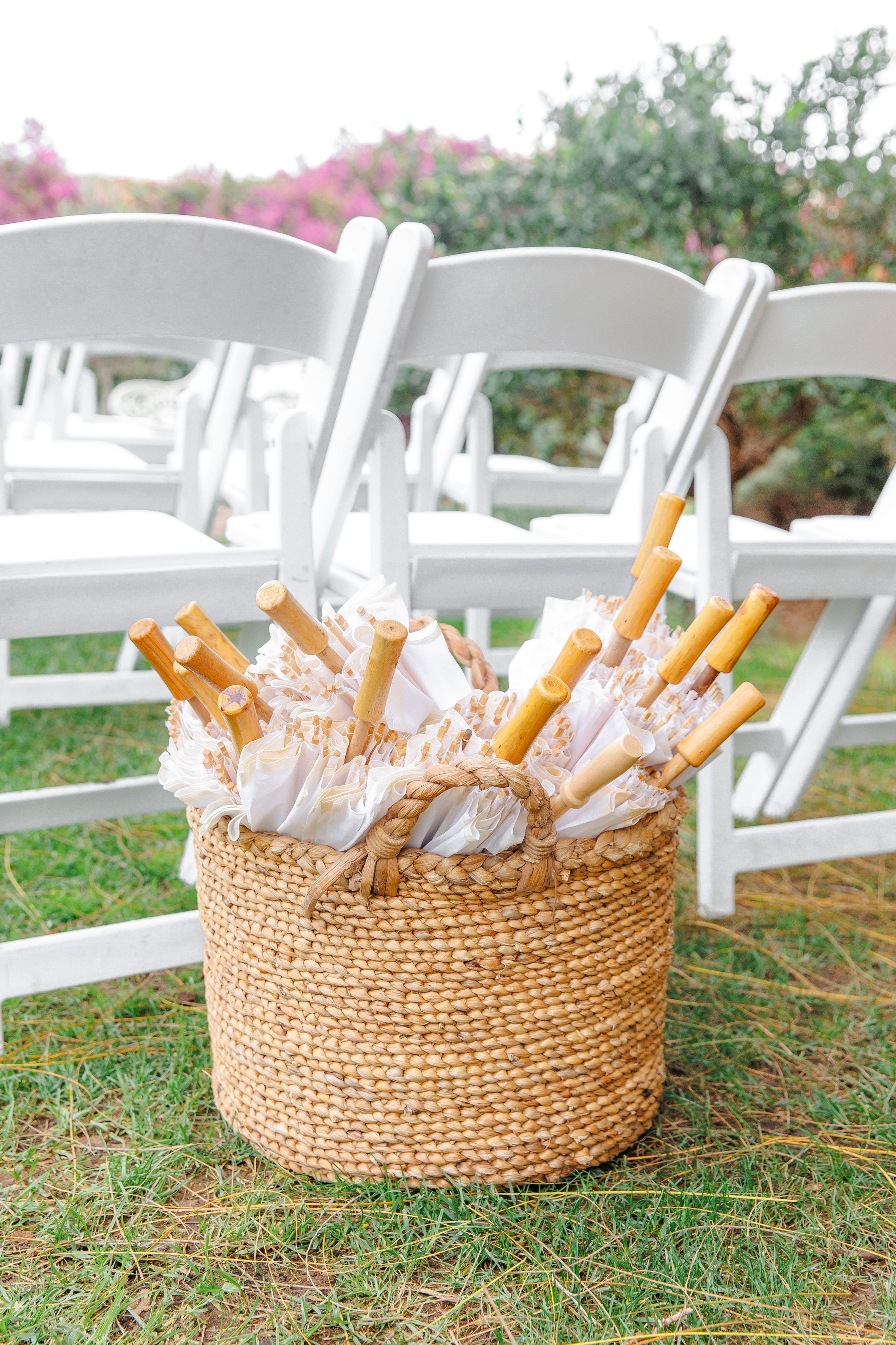 Close-up details of a garden wedding ceremony setup in Barcelona featuring elegant floral arrangements and decorated chairs.