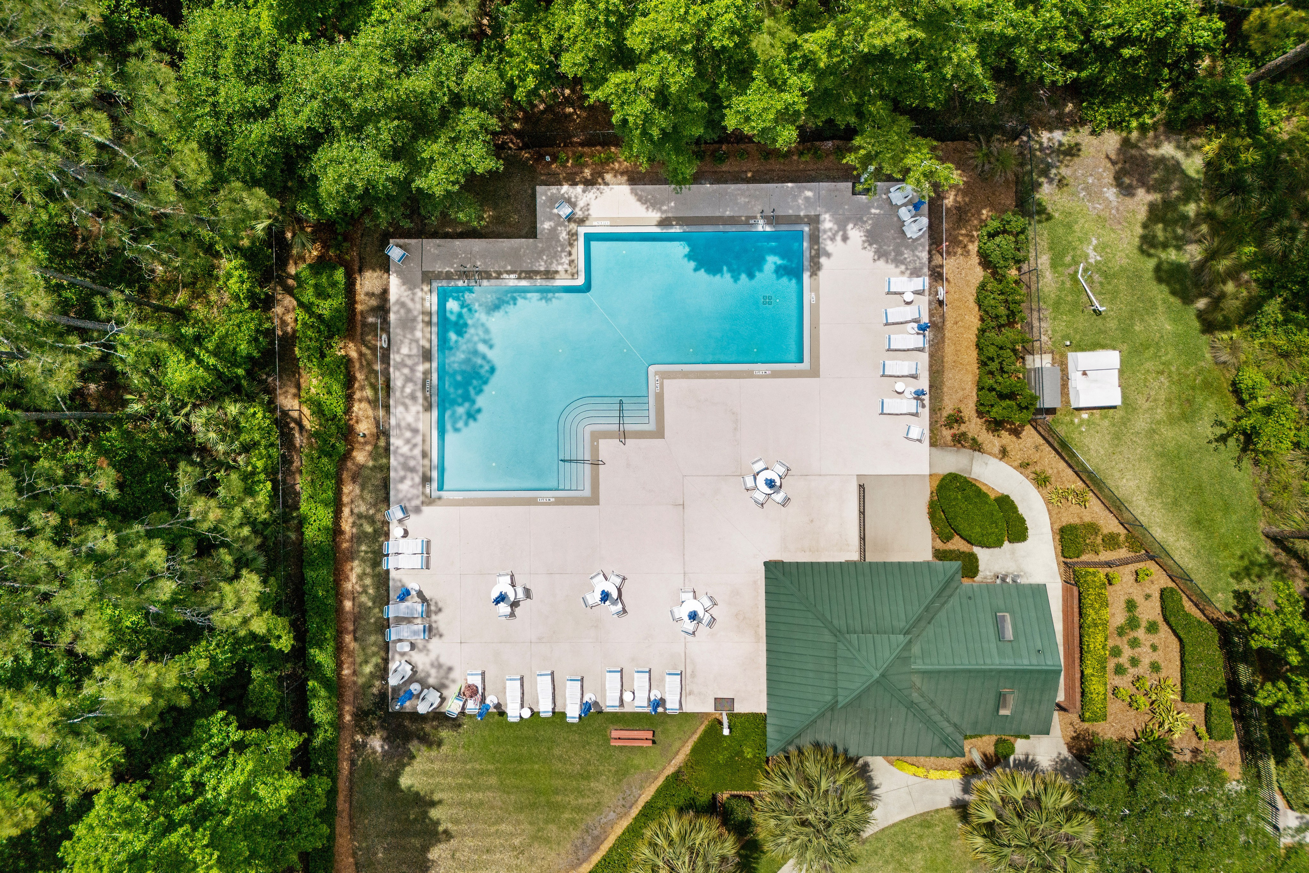 Relaxing poolside recreation area in a forested residential community