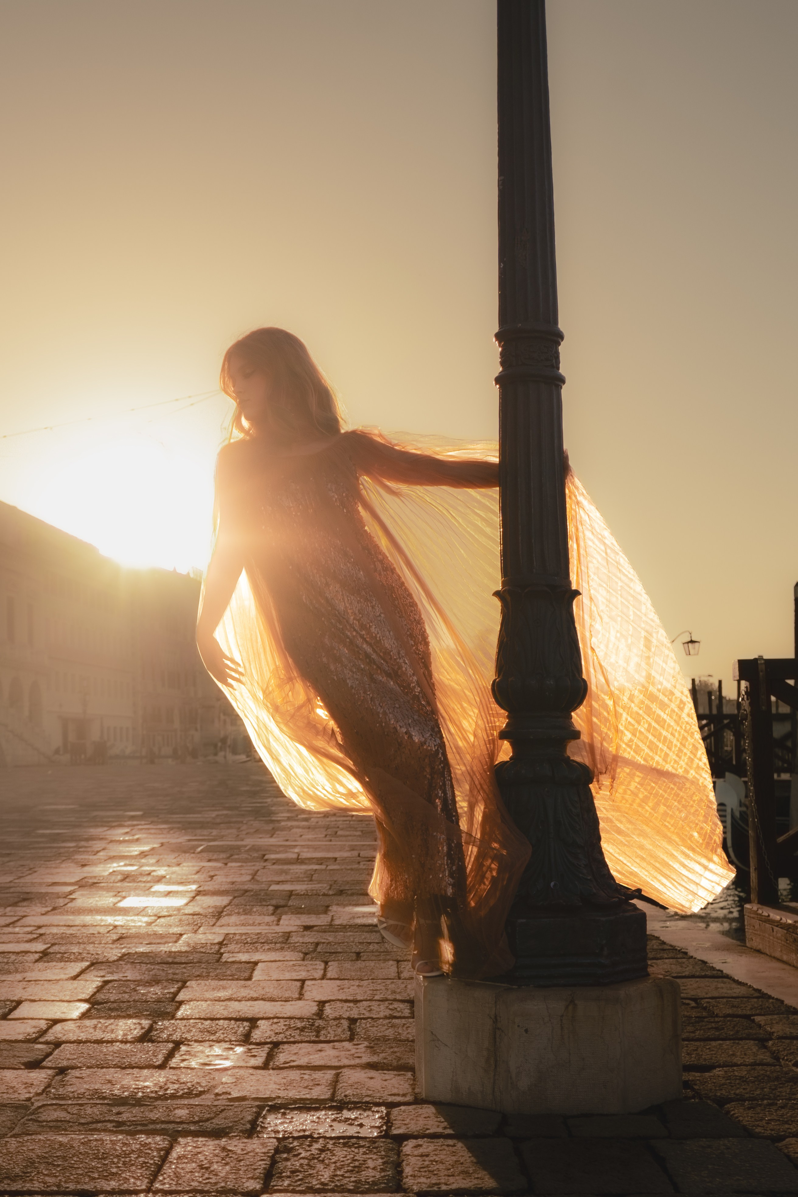  High-fashion photoshoot Venice with golden hour light near Piazza San Marco.