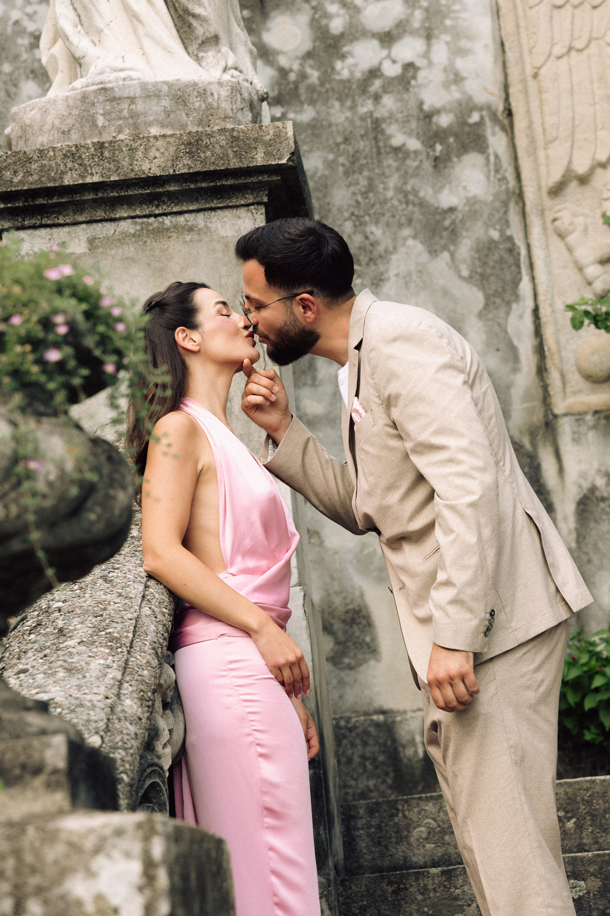 Romantic couple at Villa Monastero in Varenna during their Lake Como engagement