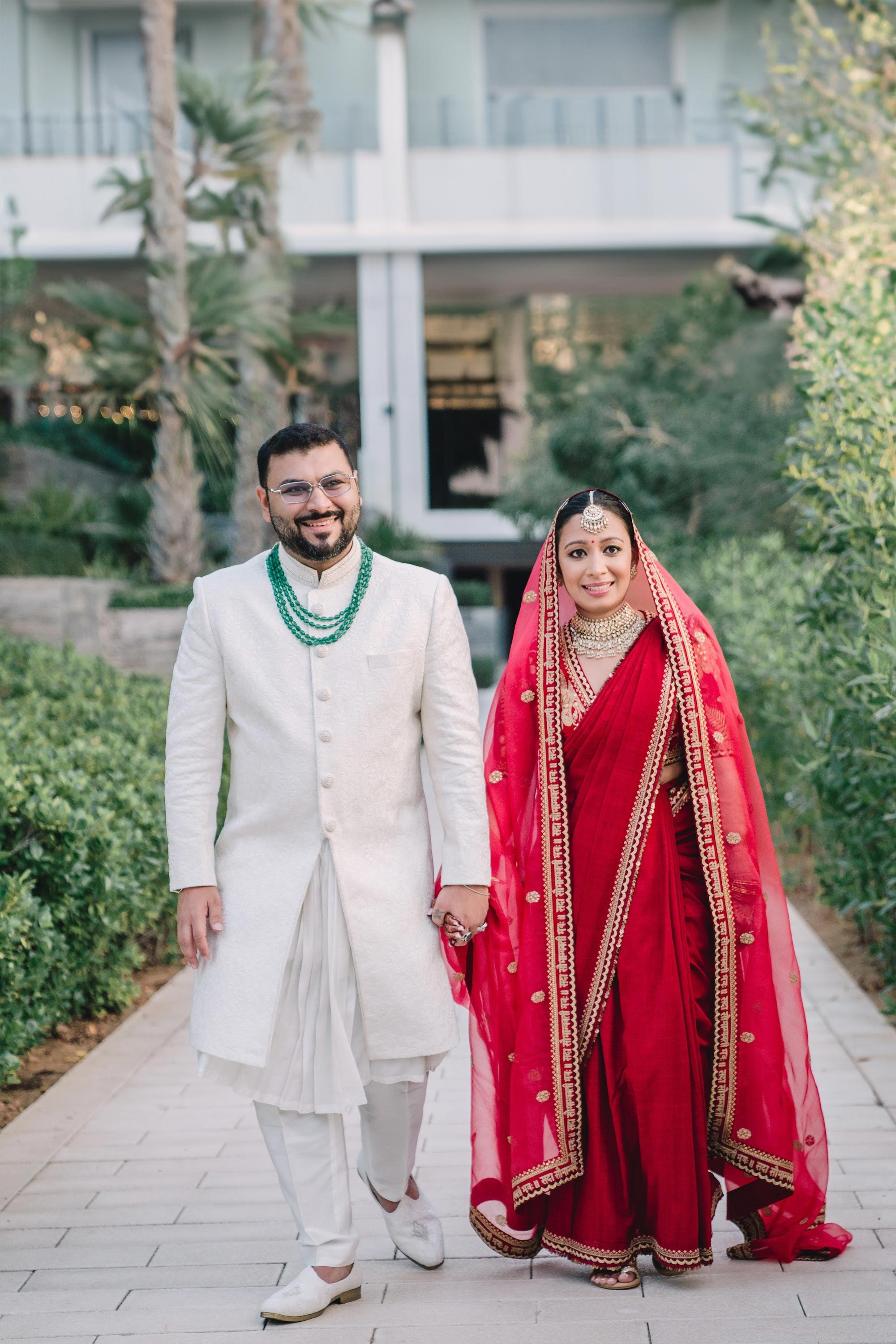 Luxury wedding photographer in Dubai capturing an elegant couple at sunset with the Burj Khalifa