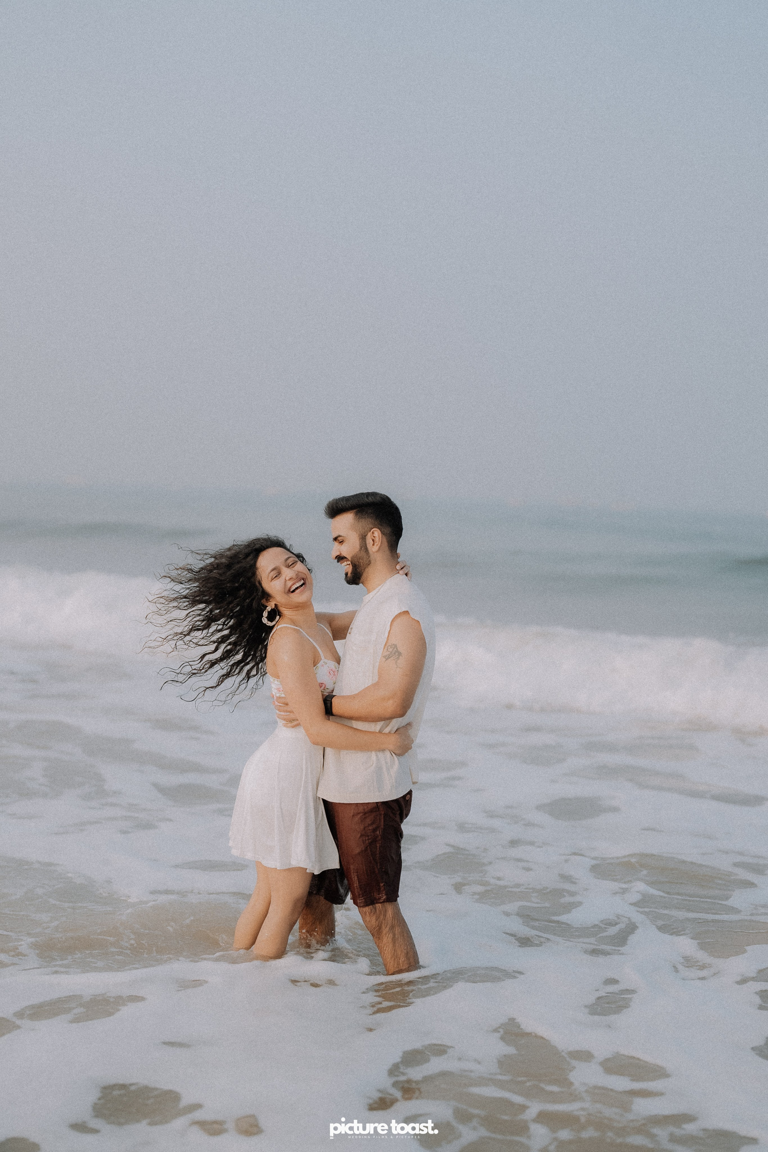 Love In The Beach. Fine art Wedding Photographers in India & Canada