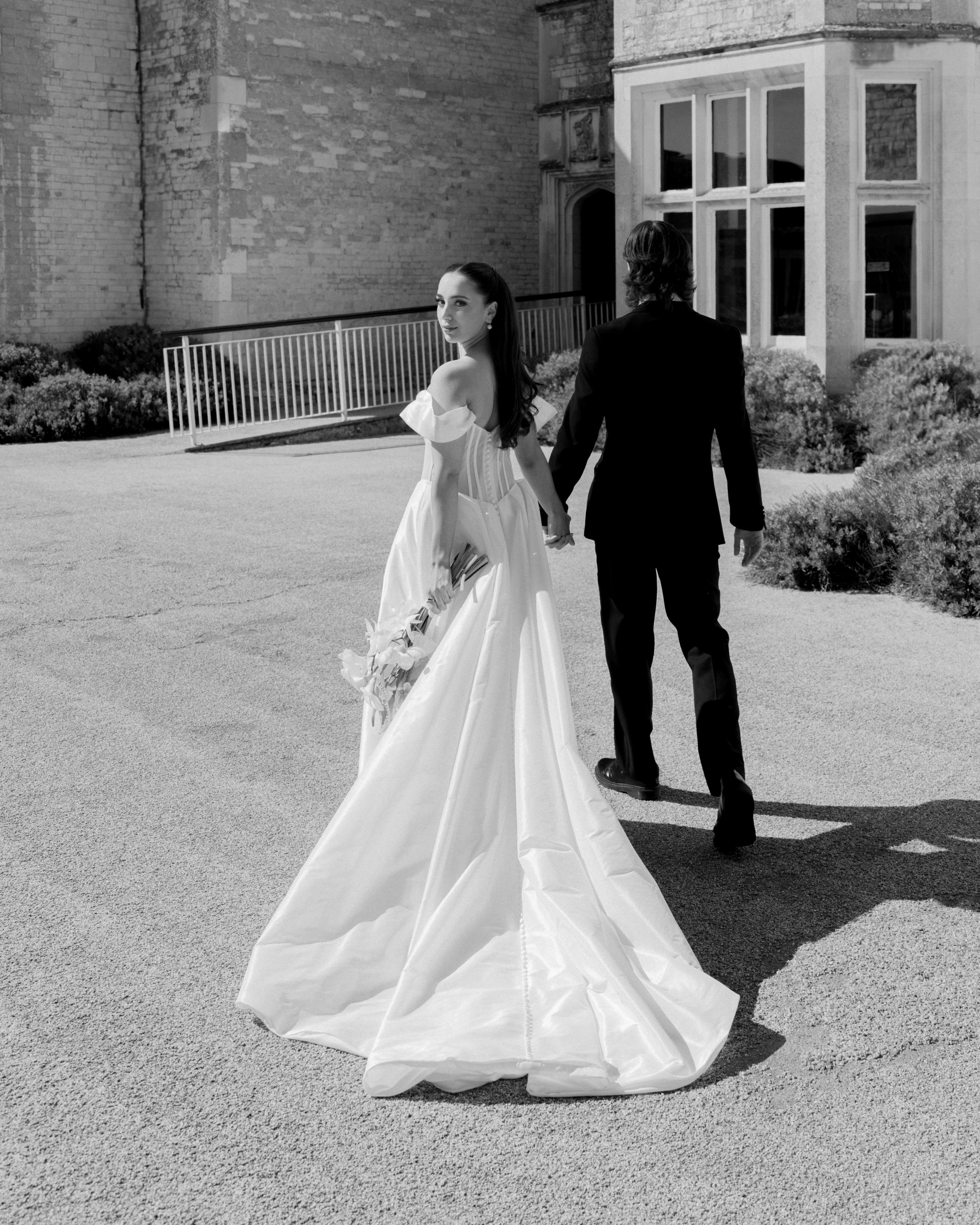 Elegant wedding portrait of bride and groom walking through the streets of ParisRomantic elopement moment captured in soft evening light in Paris, FranceLuxury wedding ceremony setup in a historic French venue with natural floralsCandid black and white photo of a couple at their city wedding in London, UKTimeless couple portrait in front of Marylebone Town Hall, LondonEditorial-style bridal preparation in a classic townhouse in the heart of LondonSoft light bridal portrait in a countryside château wedding in FranceFine art flat lay with French-inspired wedding details and vintage texturesCinematic golden hour photo at a UK estate wedding with historic architectureLuxury wedding tablescape with candles and florals at a London reception