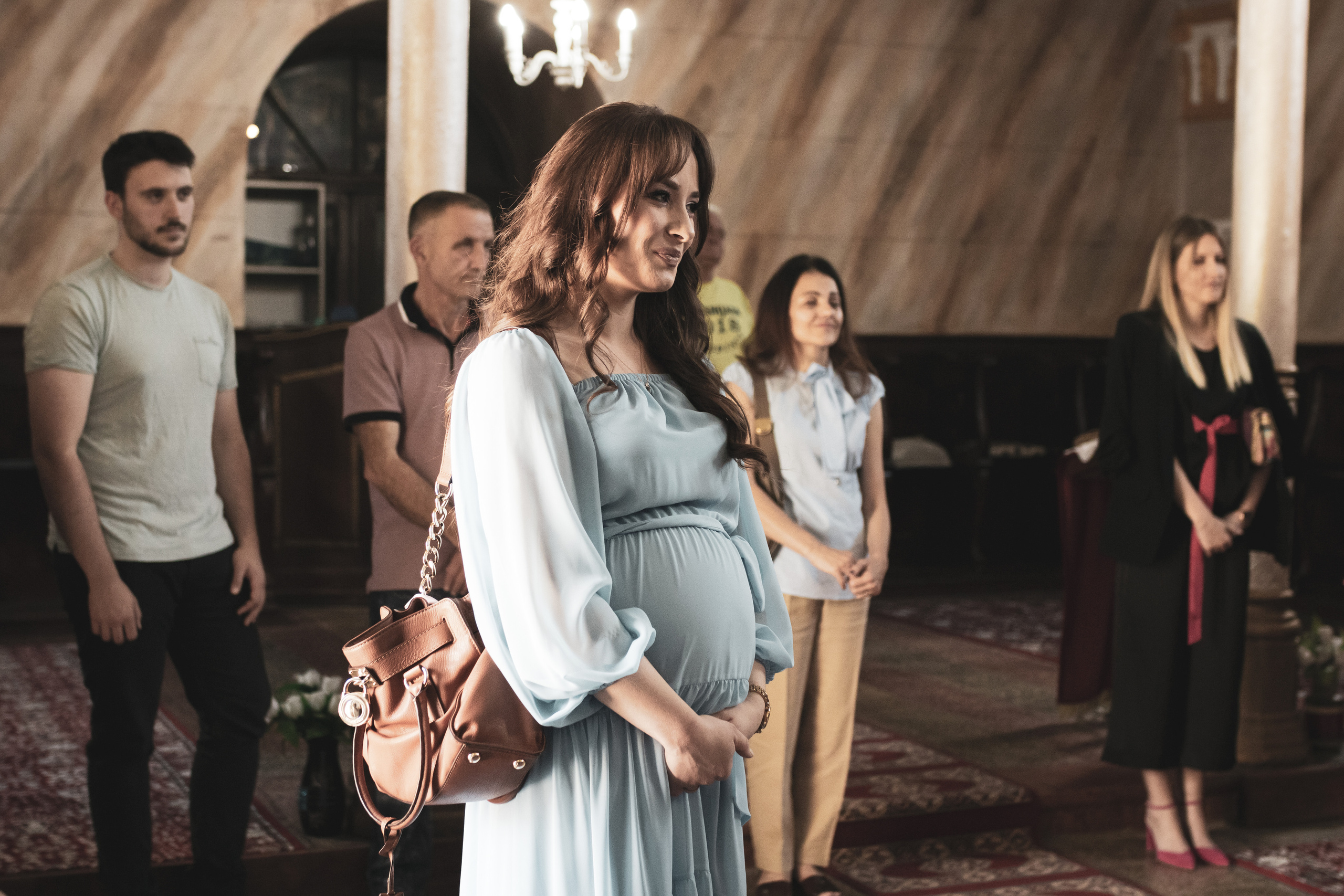 fotografija trudnice na krštenju