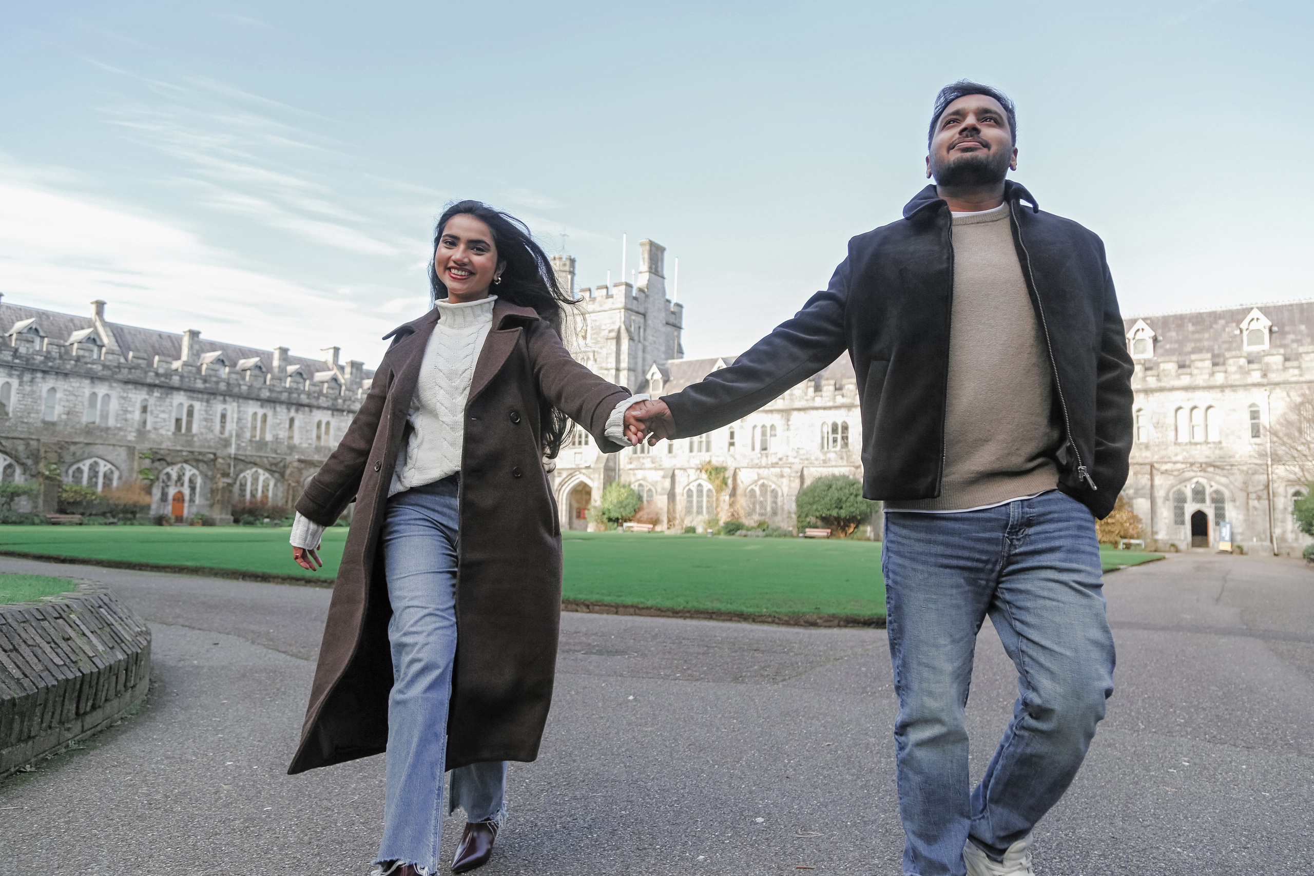 A confident and joyful walk through historic surroundings, blending architecture, movement, and shared energy.