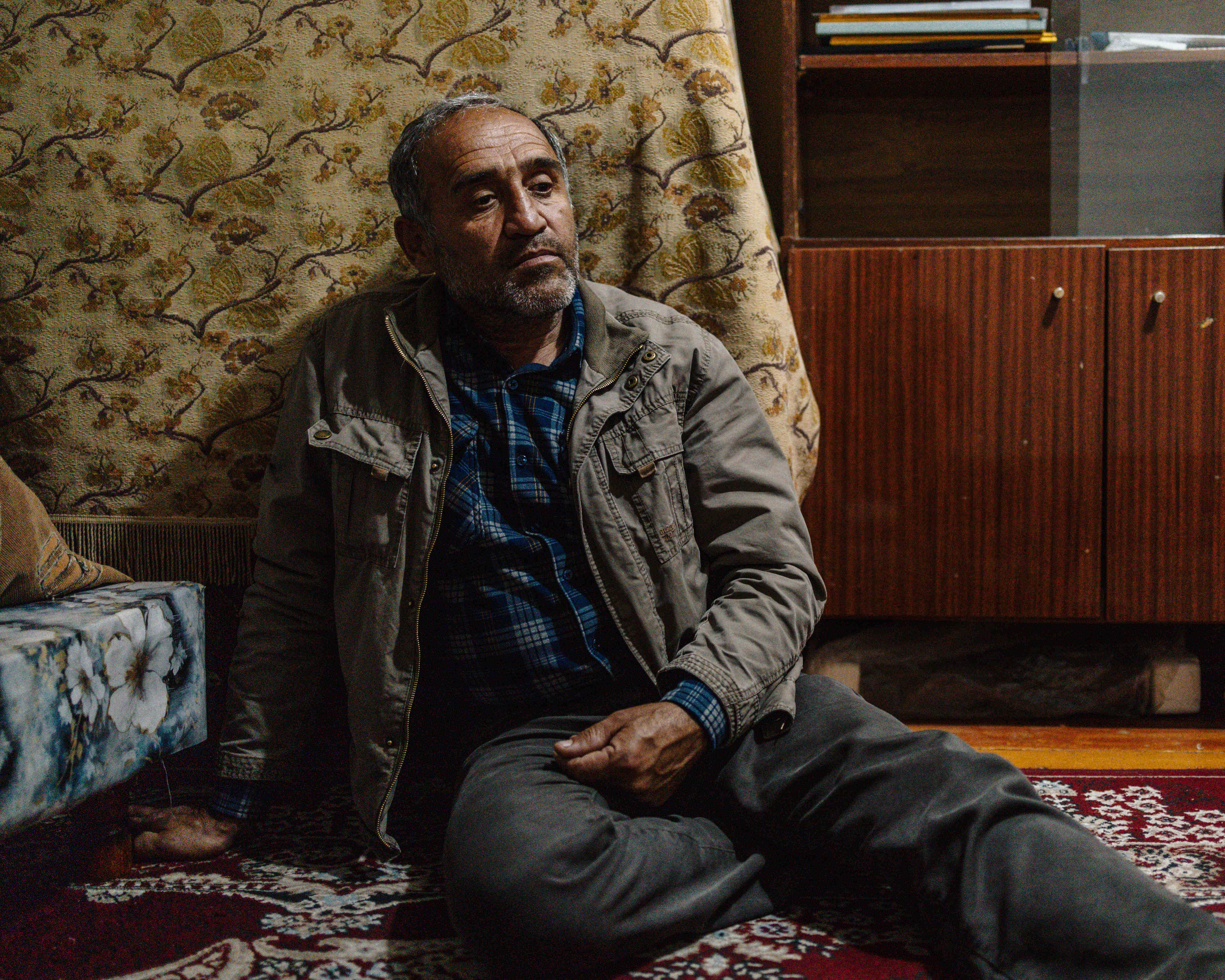 Saidali, 52, rests in his rented home in Dushanbe. After giving his own house to his disabled brother, he now lives here with his wife and youngest son. He works as a construction master and currently has eight apprentices across the city. For 22 years, since his first son was born, he has stood on the street each day to look for construction jobs. His two older sons are now studying in Kazan on scholarships and plan to stay in Russia after graduation, where the family hopes to reunite once the youngest son finishes high school.