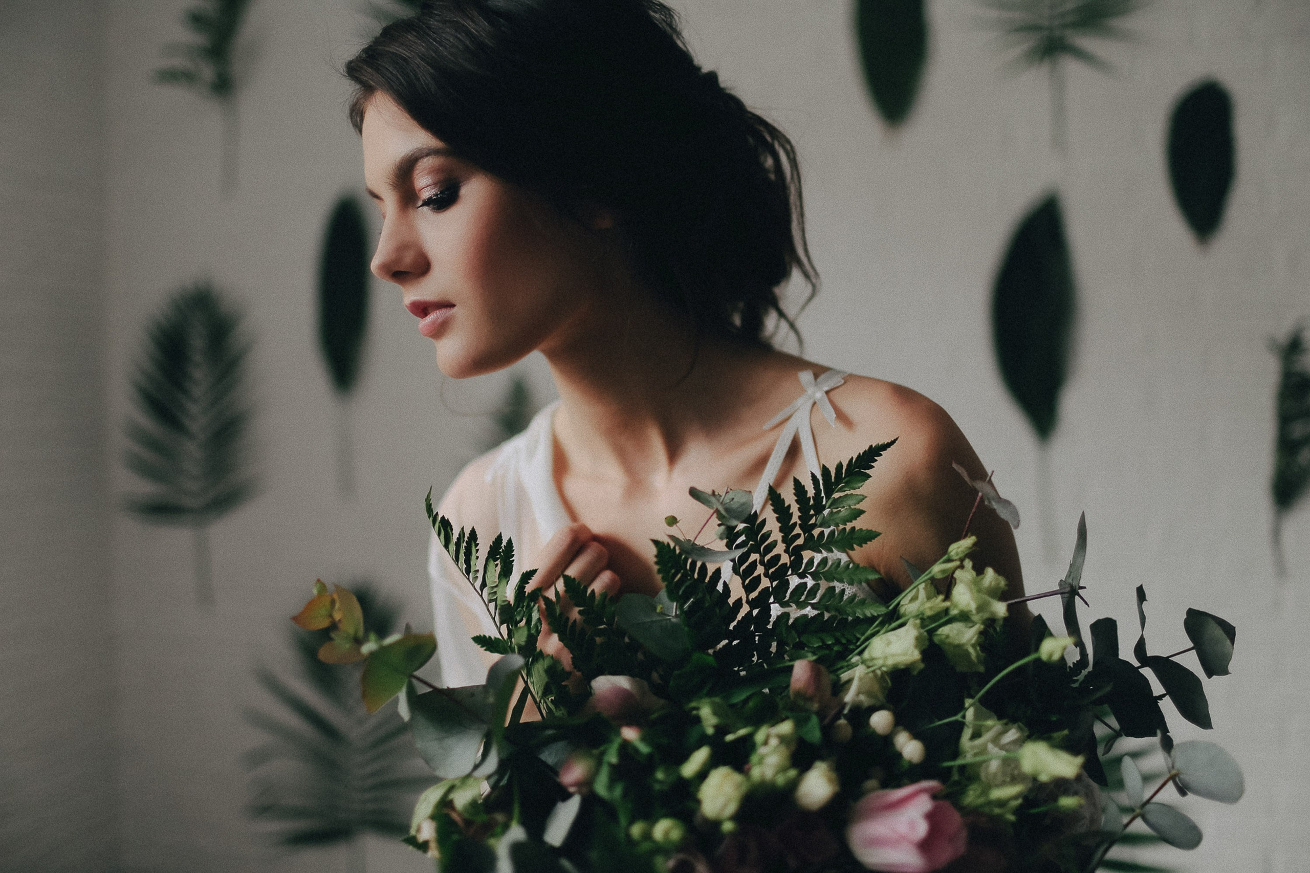 Bride holding bouquet, wedding preparation moment