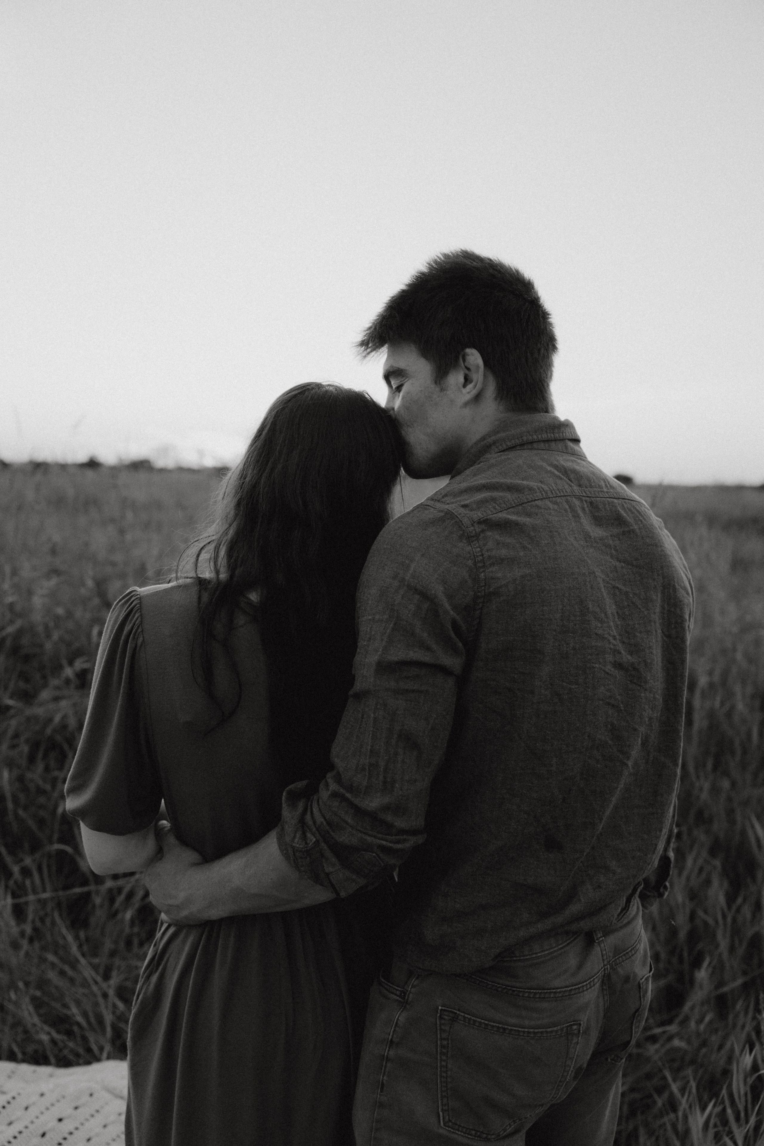 Partner wrapping arms from behind