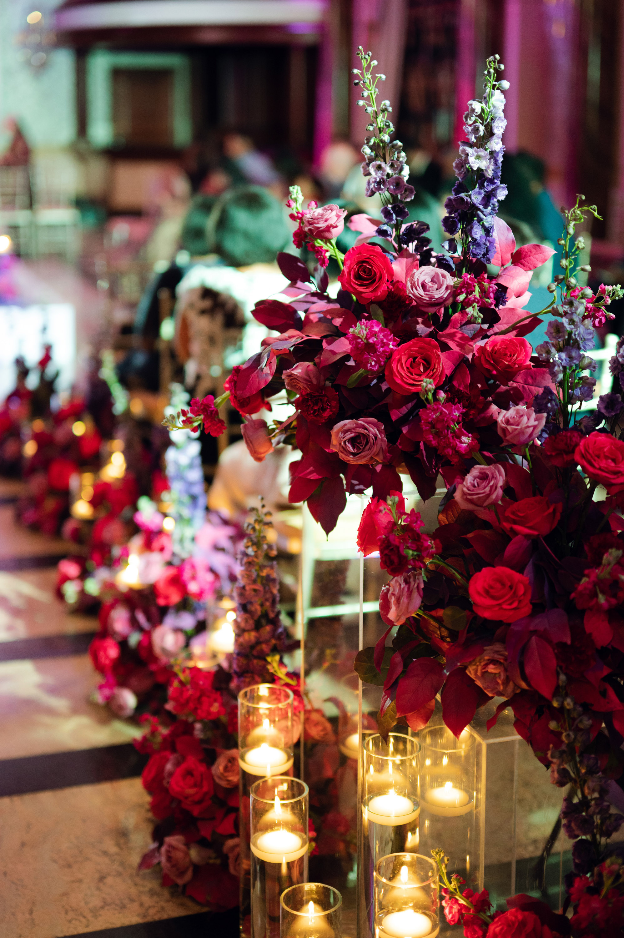 a table with candles and flowers on it