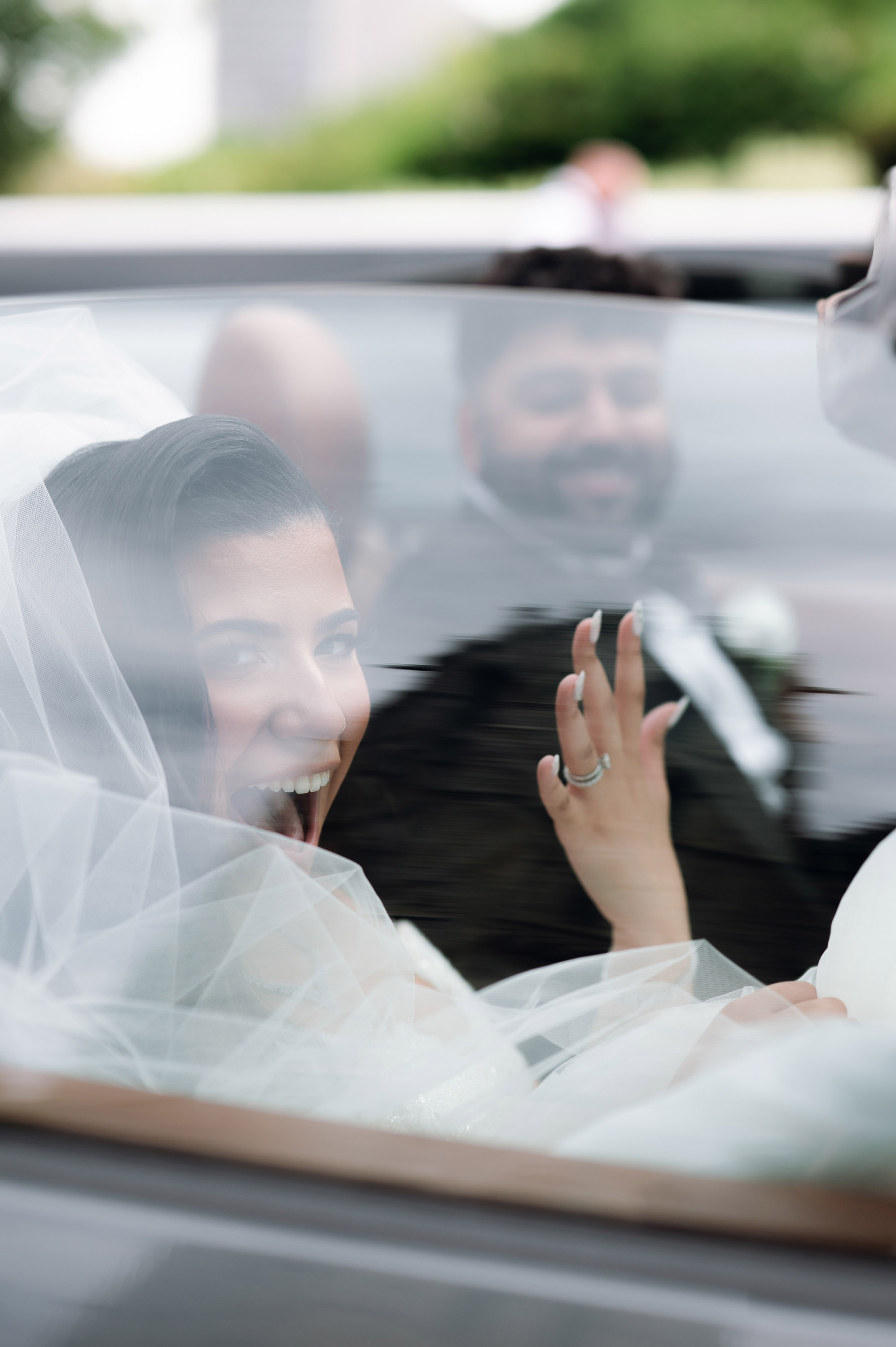 a bride and groom in a car