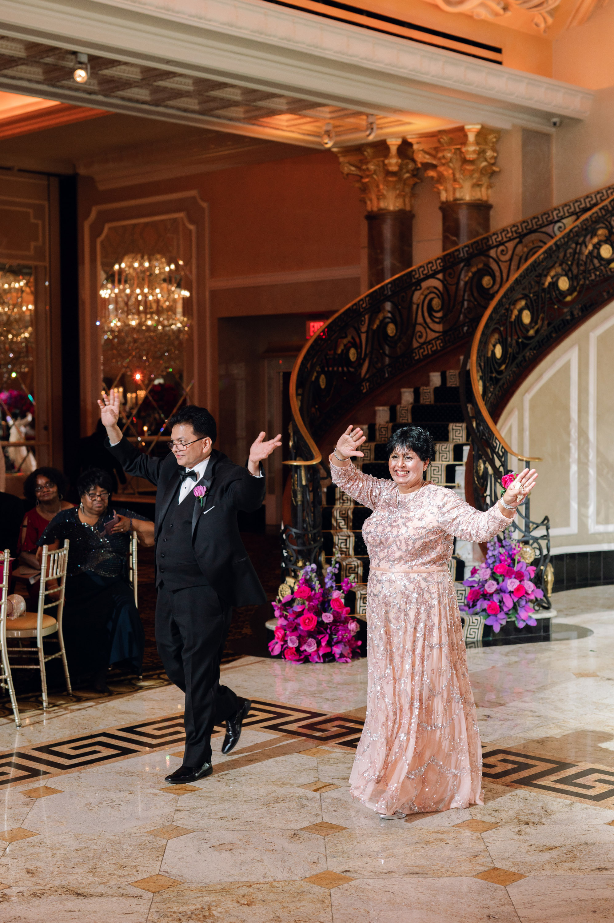 a man and woman dancing in a ballroom