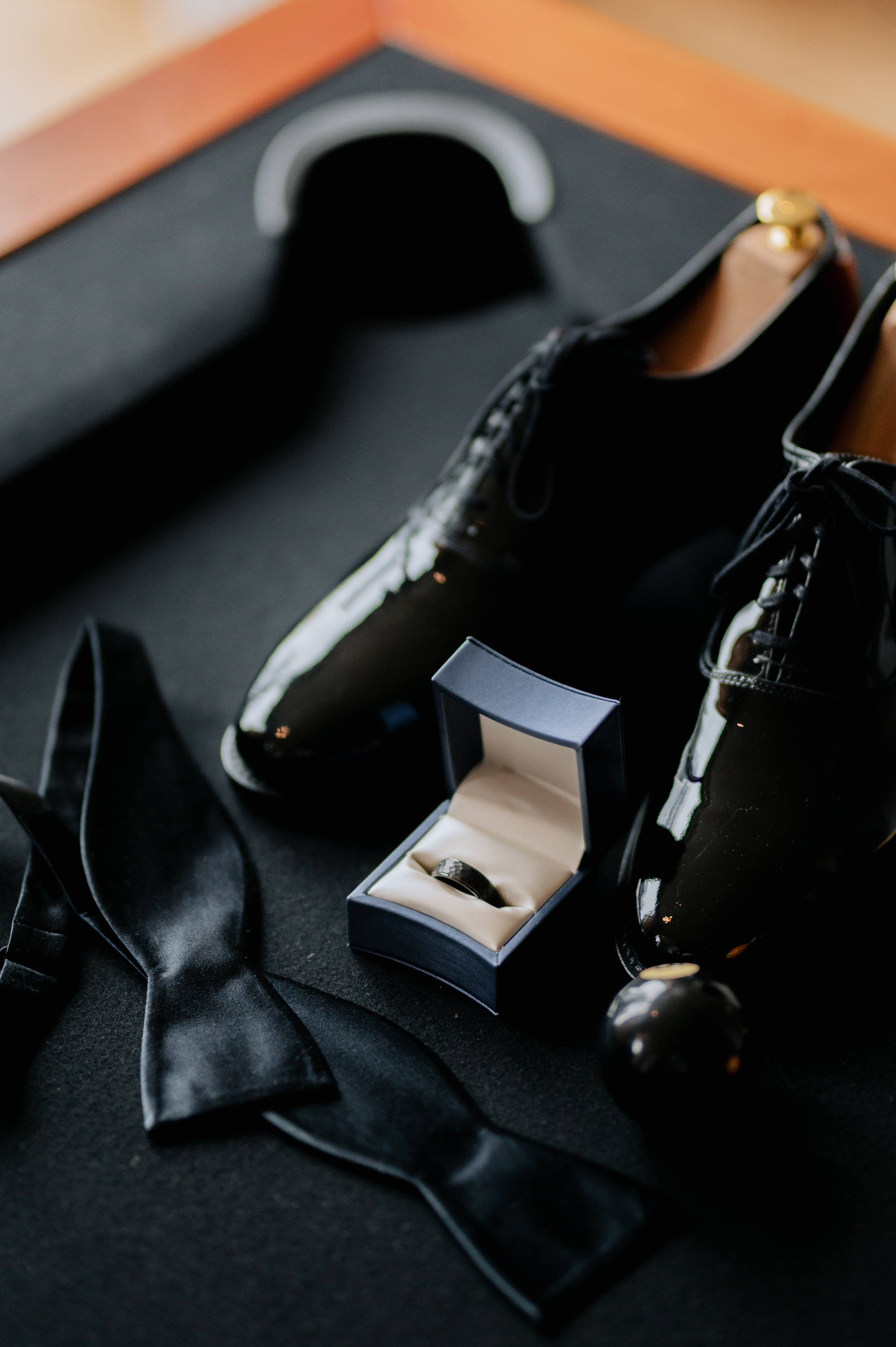 a pair of shoes and a tie on a table