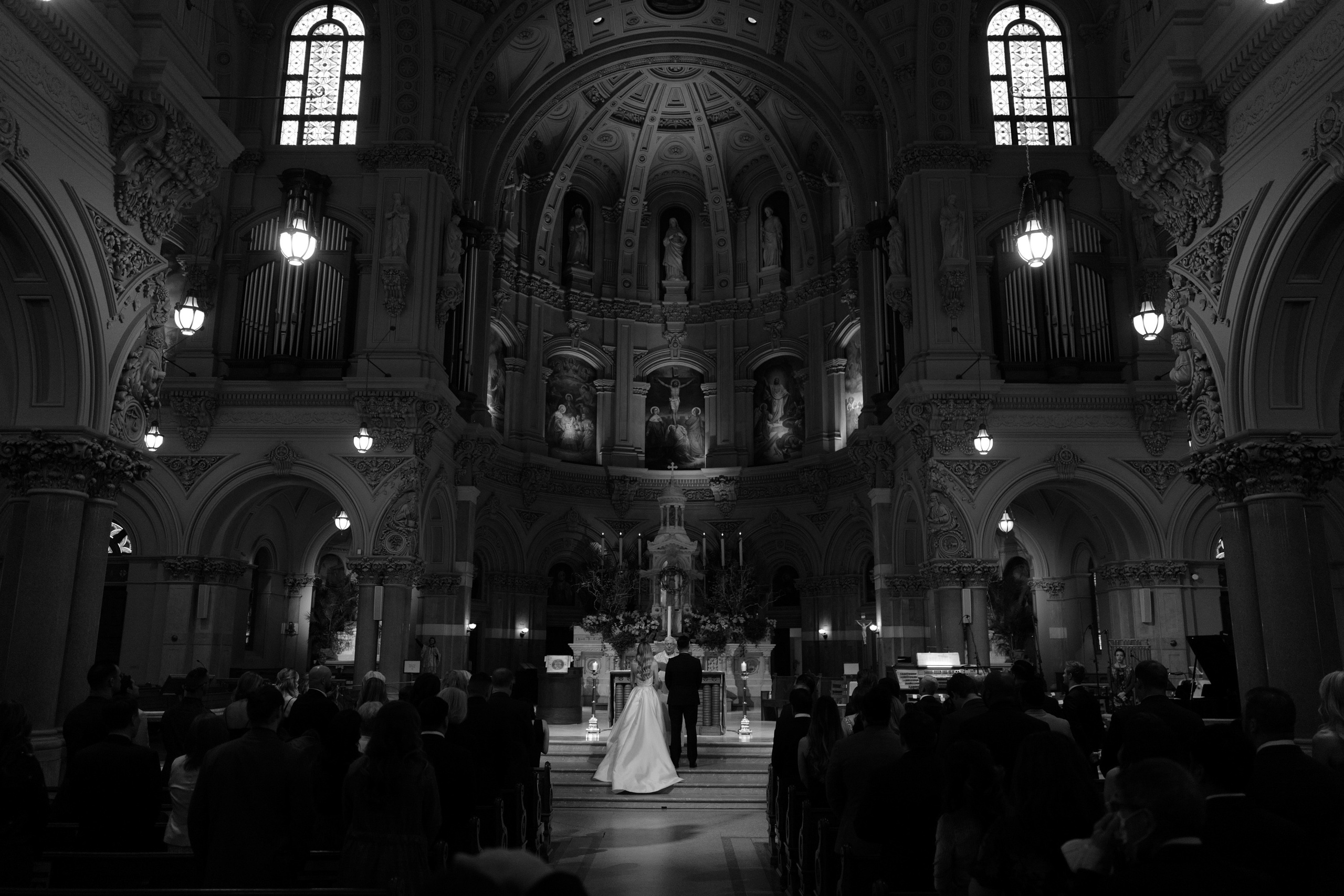 a bride and groom walking down the aisle at their wedding