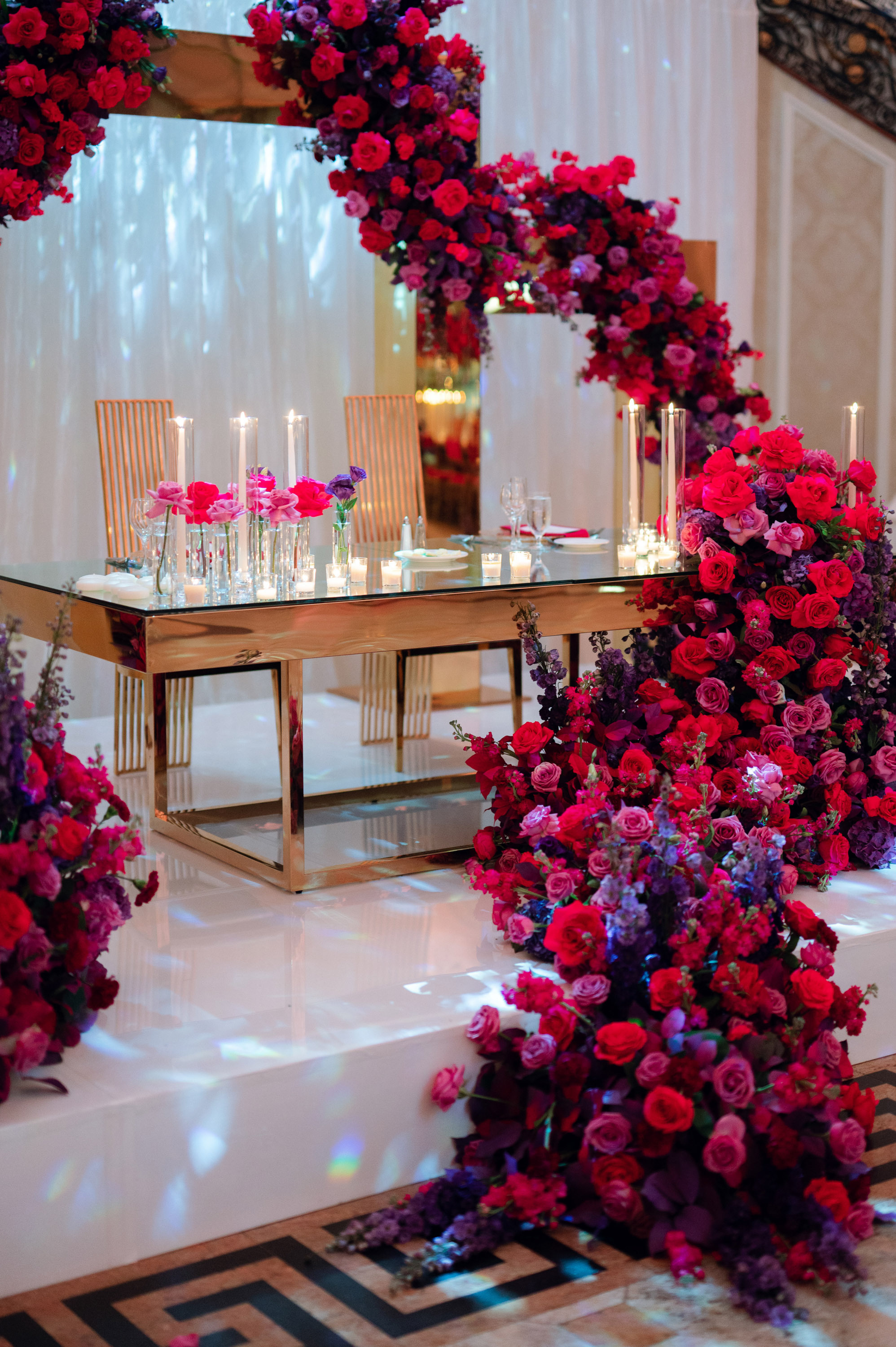 a table with flowers and candles on it
