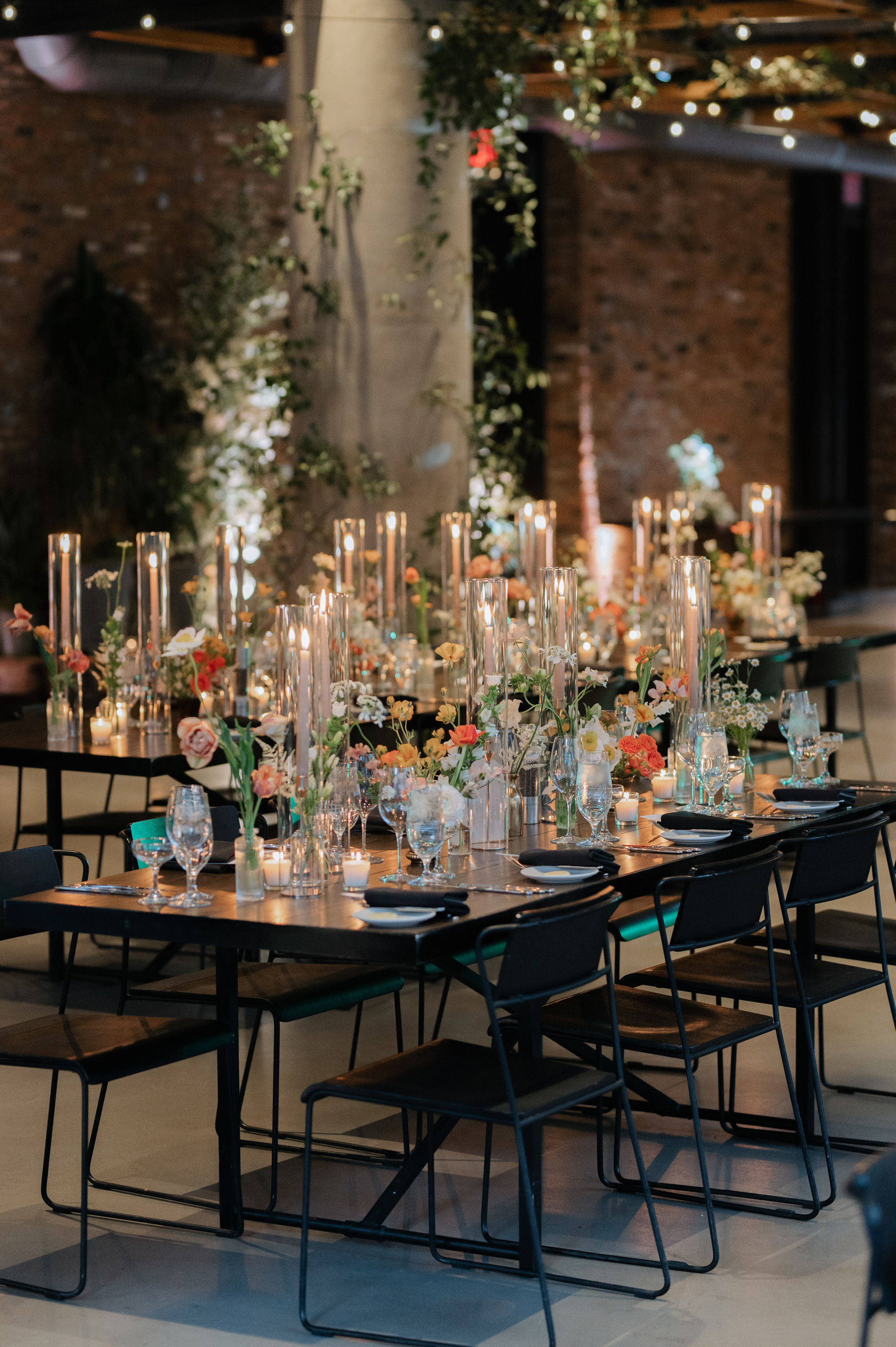 a long table with candles and flowers