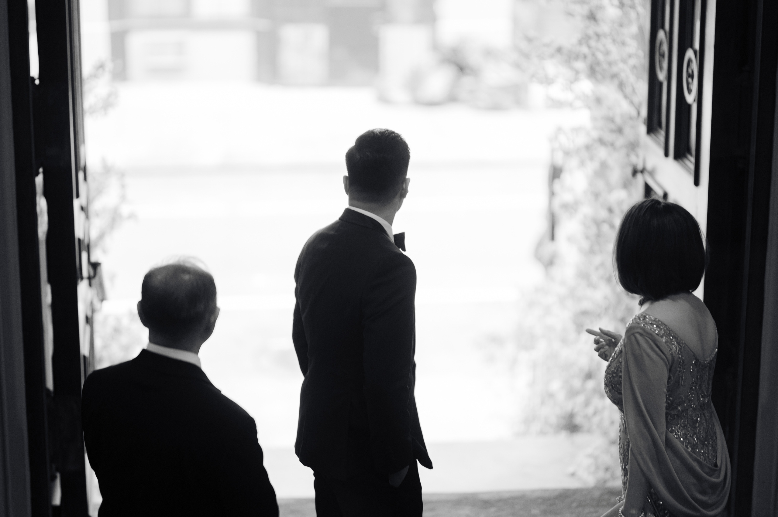 a man and woman standing in a doorway