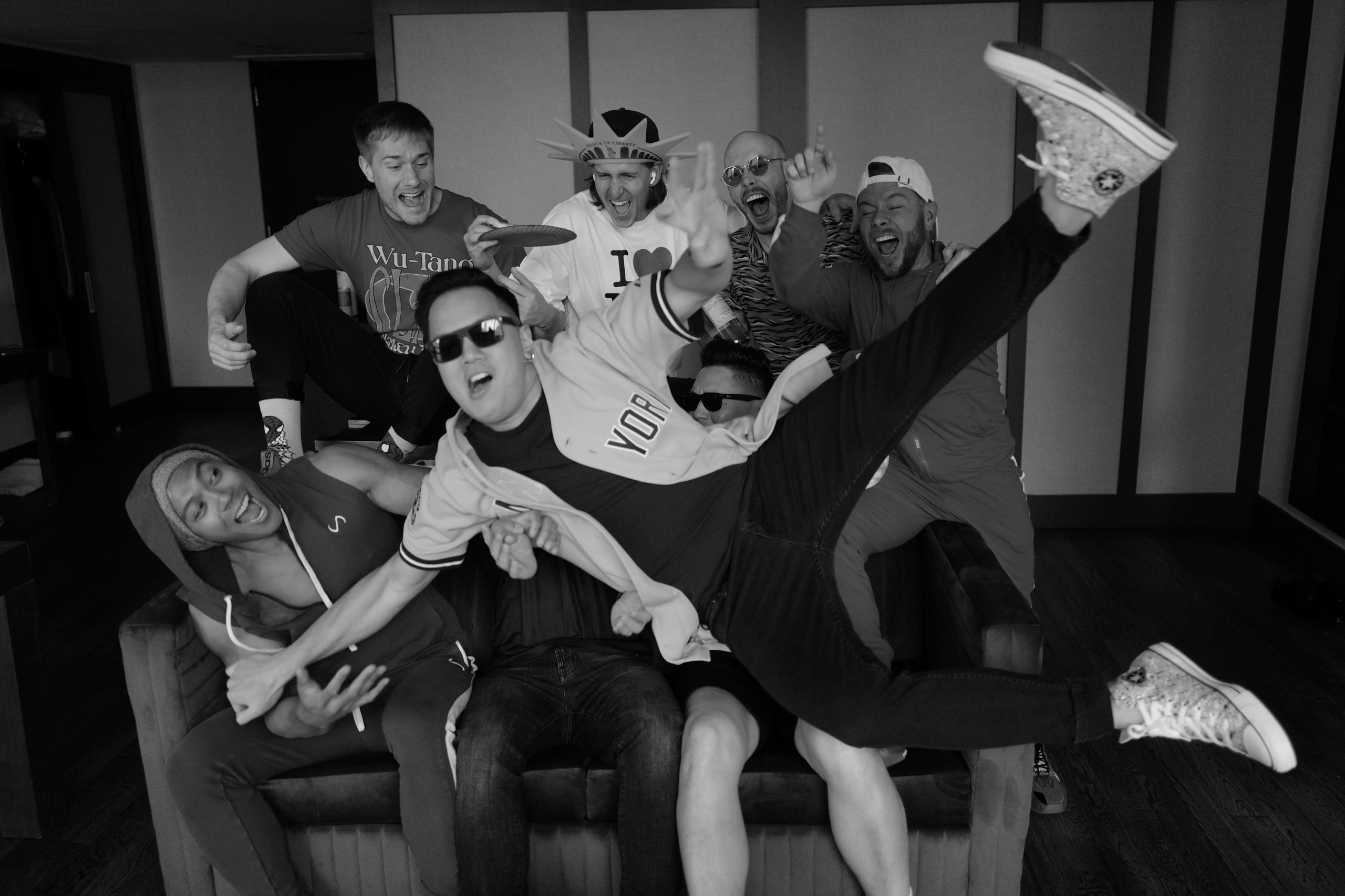 a group of men sitting on a couch