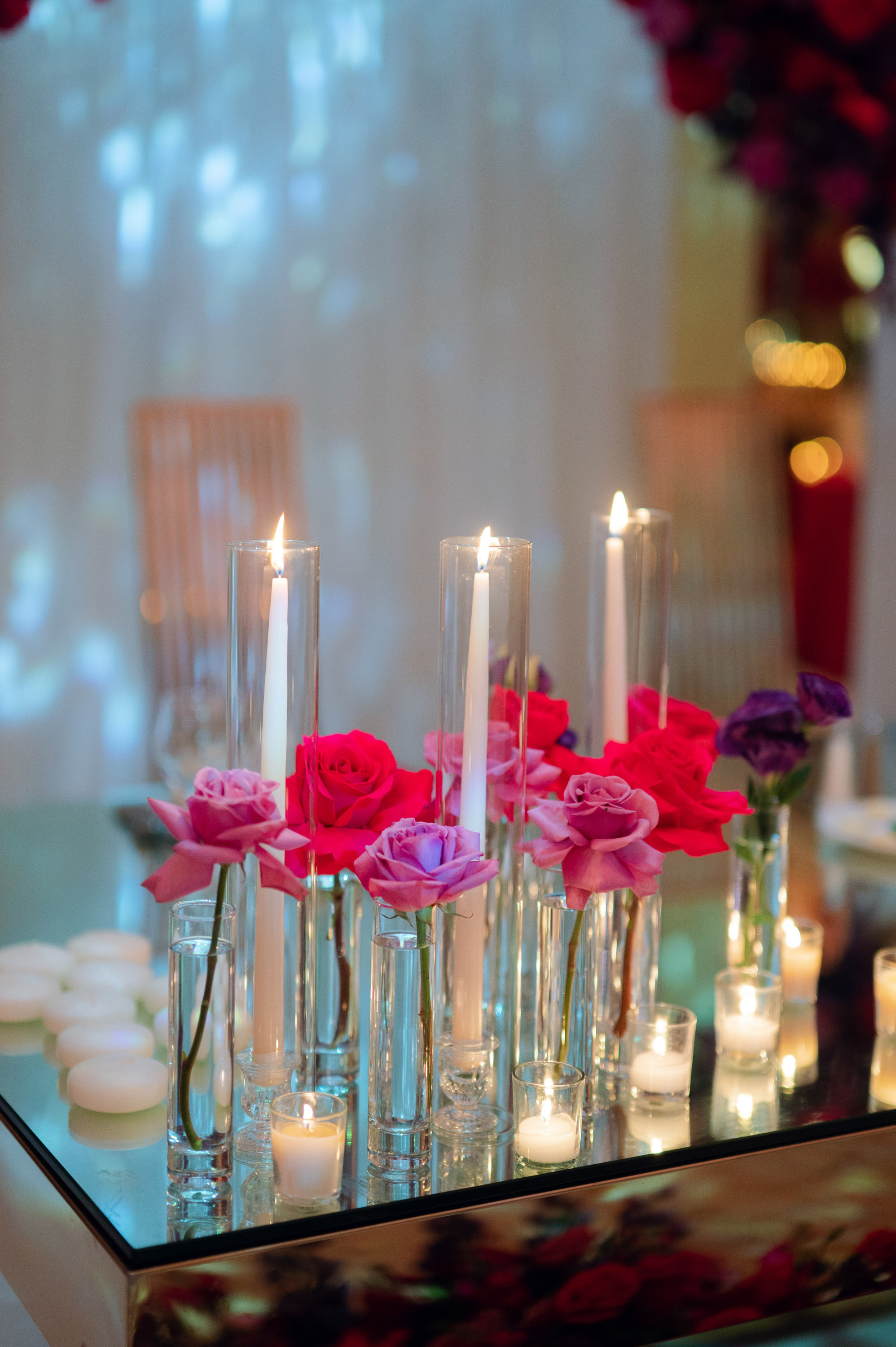 a table with candles and flowers on it