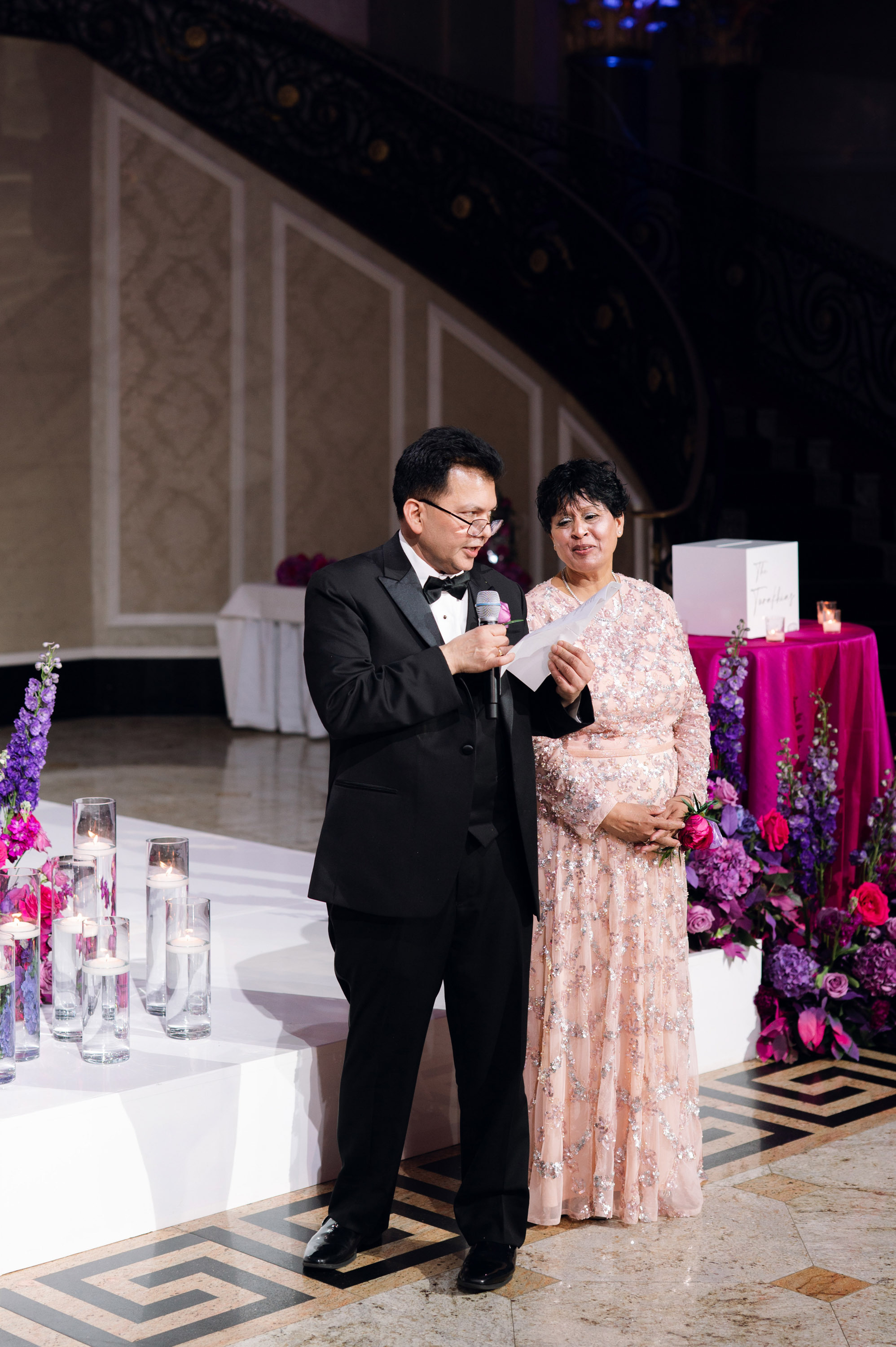 a man and woman standing next to each other people