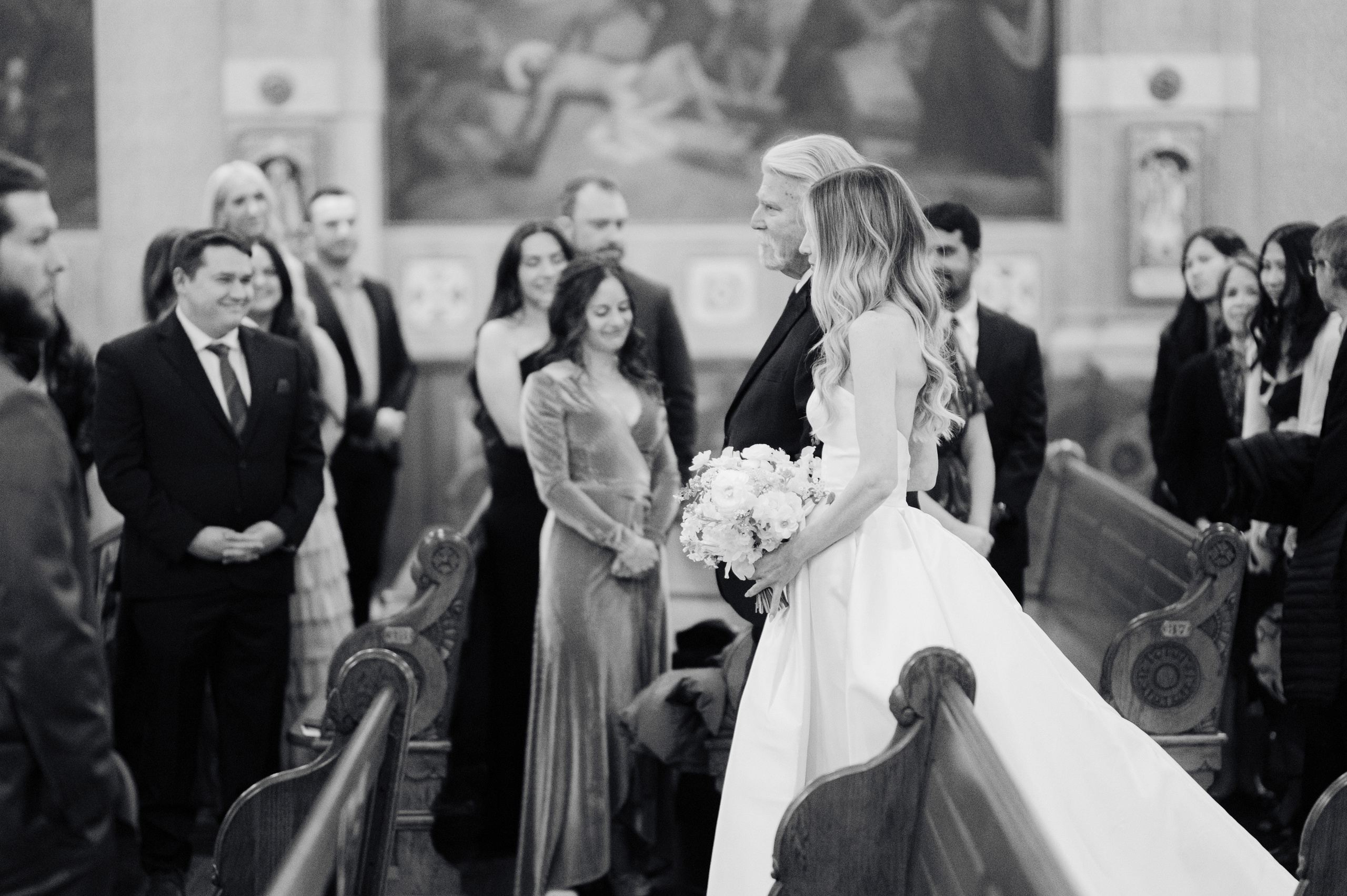 a bride walking down the aisle at a wedding