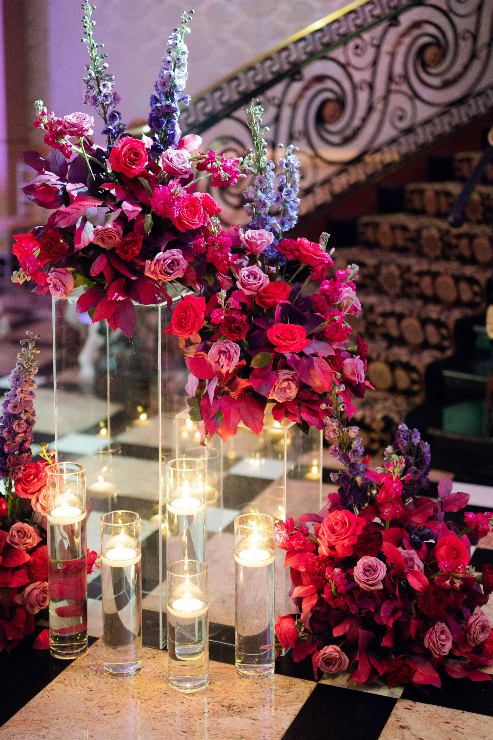 a table with a bunch of flowers and candles
