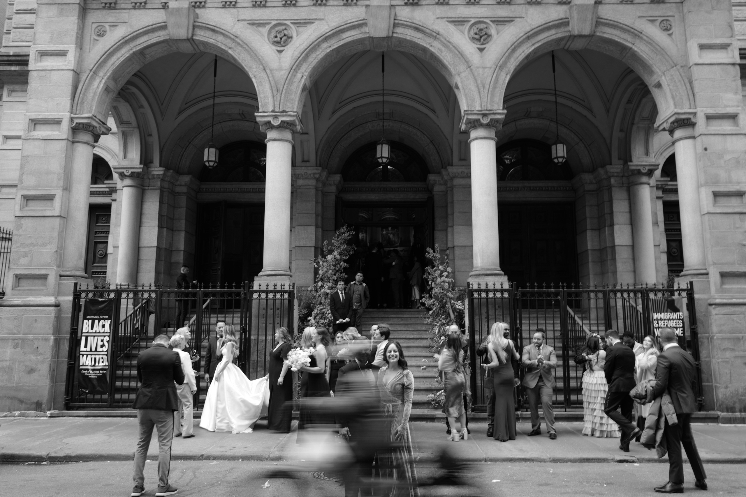 a group of people standing outside of a building