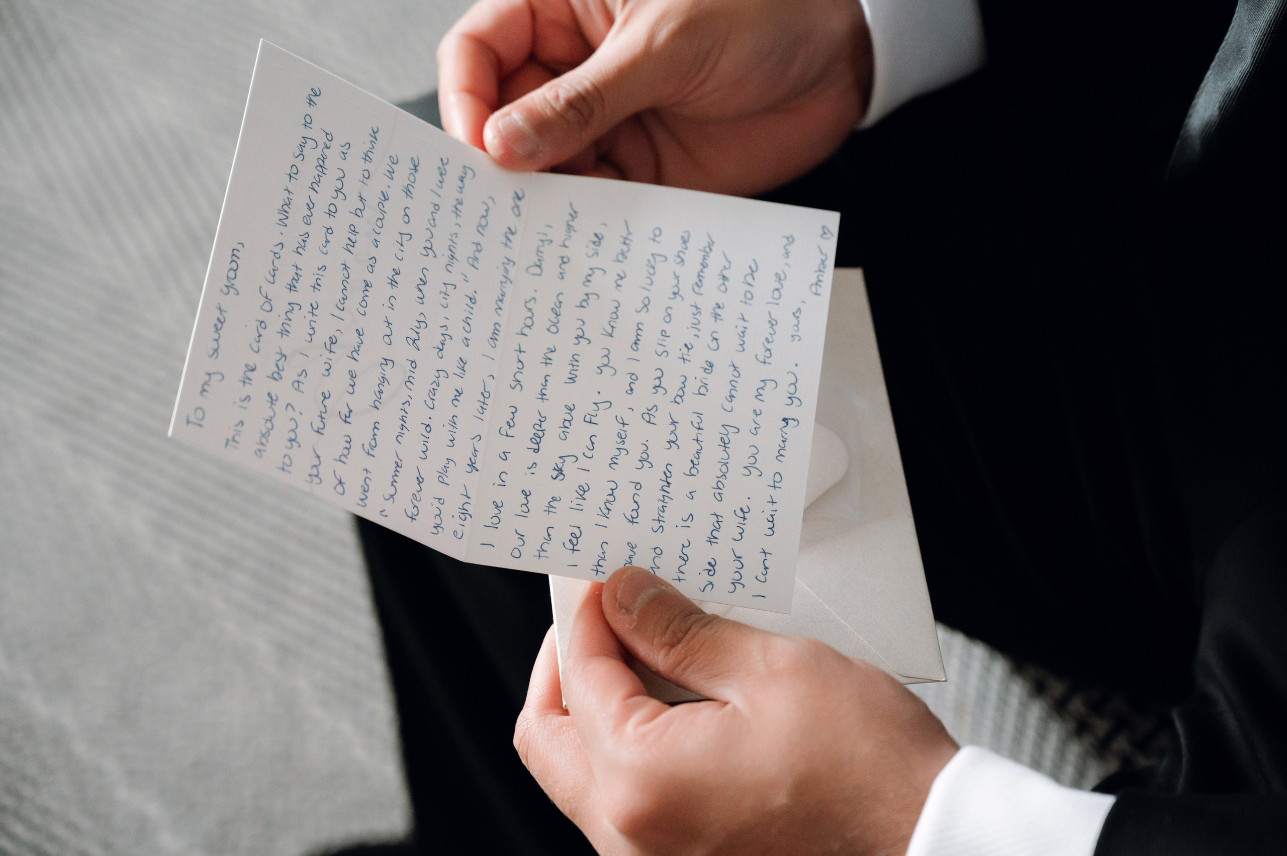 a person holding a piece of paper with writing on it