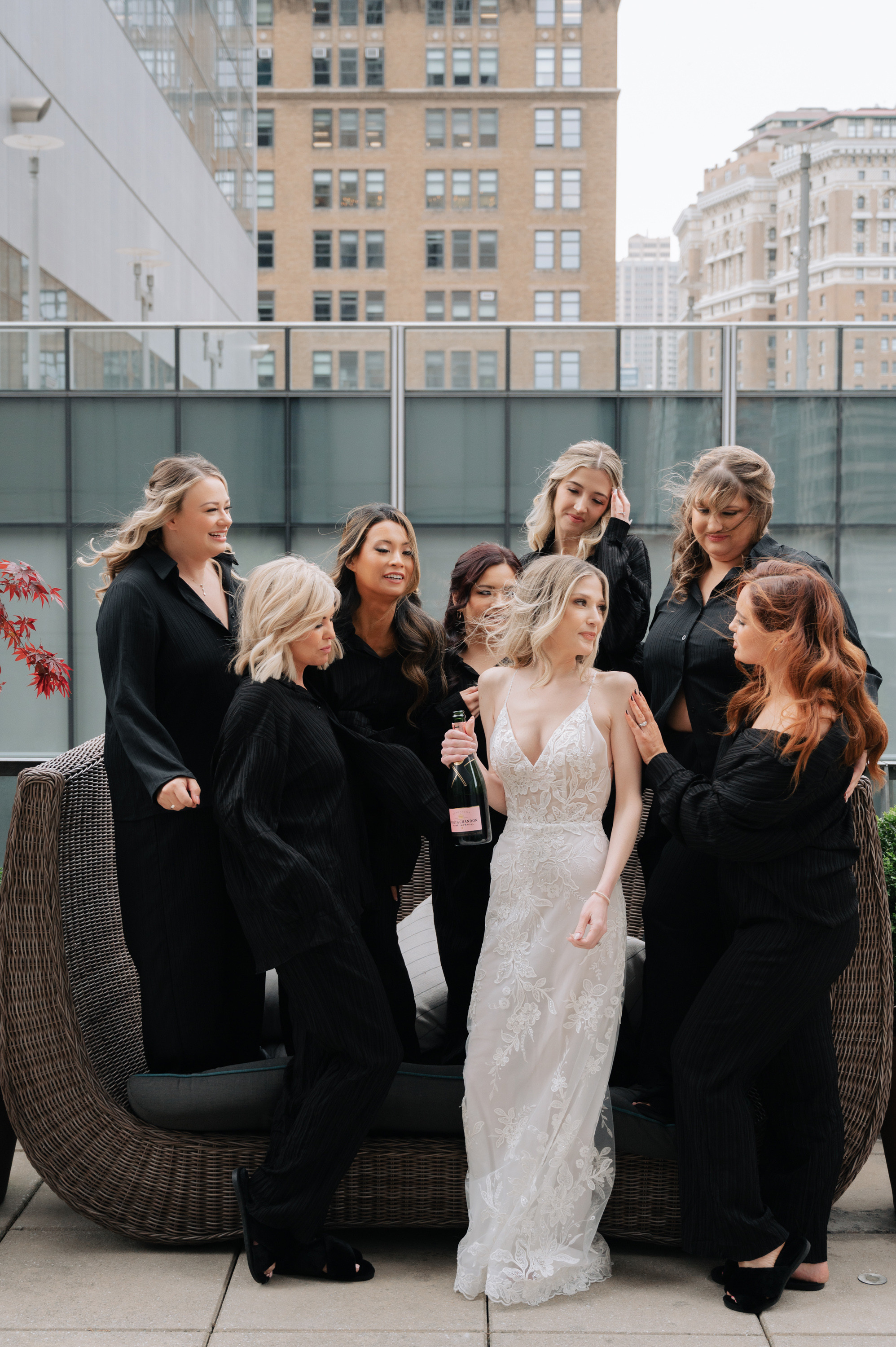 a group of women standing around a couch