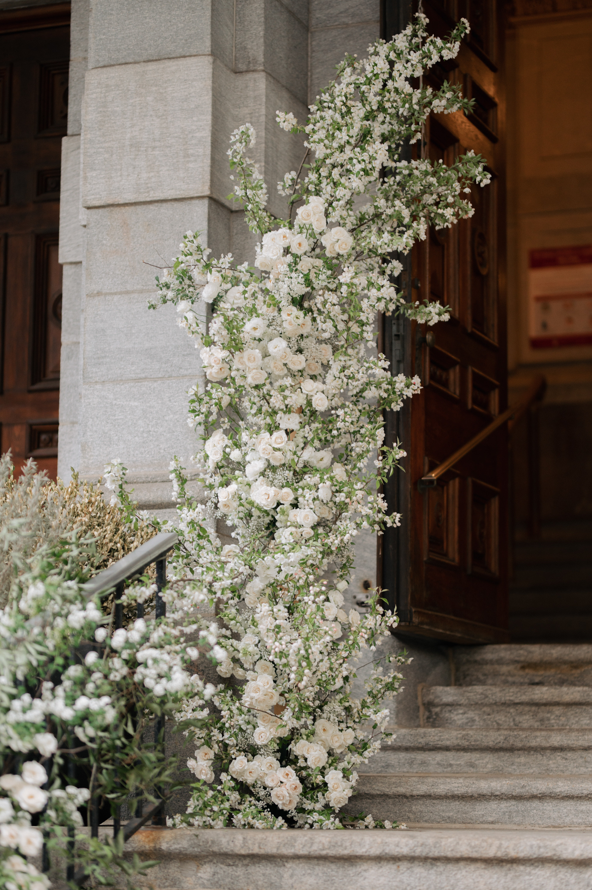 a bunch of flowers on a stone staircase