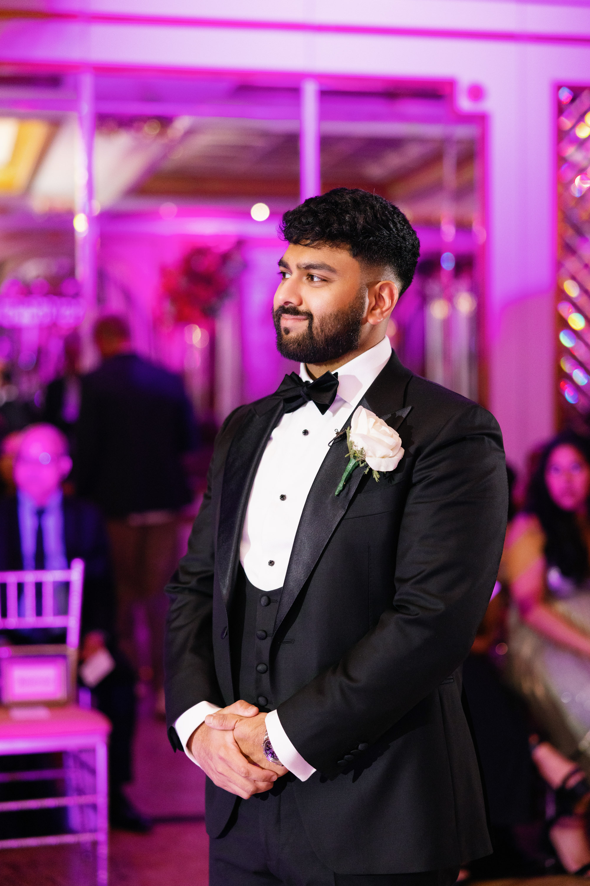 a man in a tuxed suit and bow tie