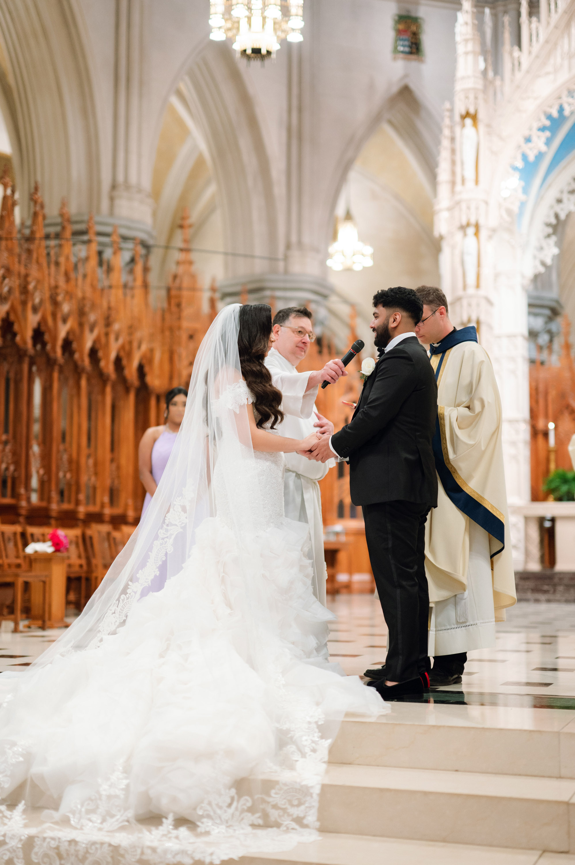 a bride and groom are standing in front of the alter