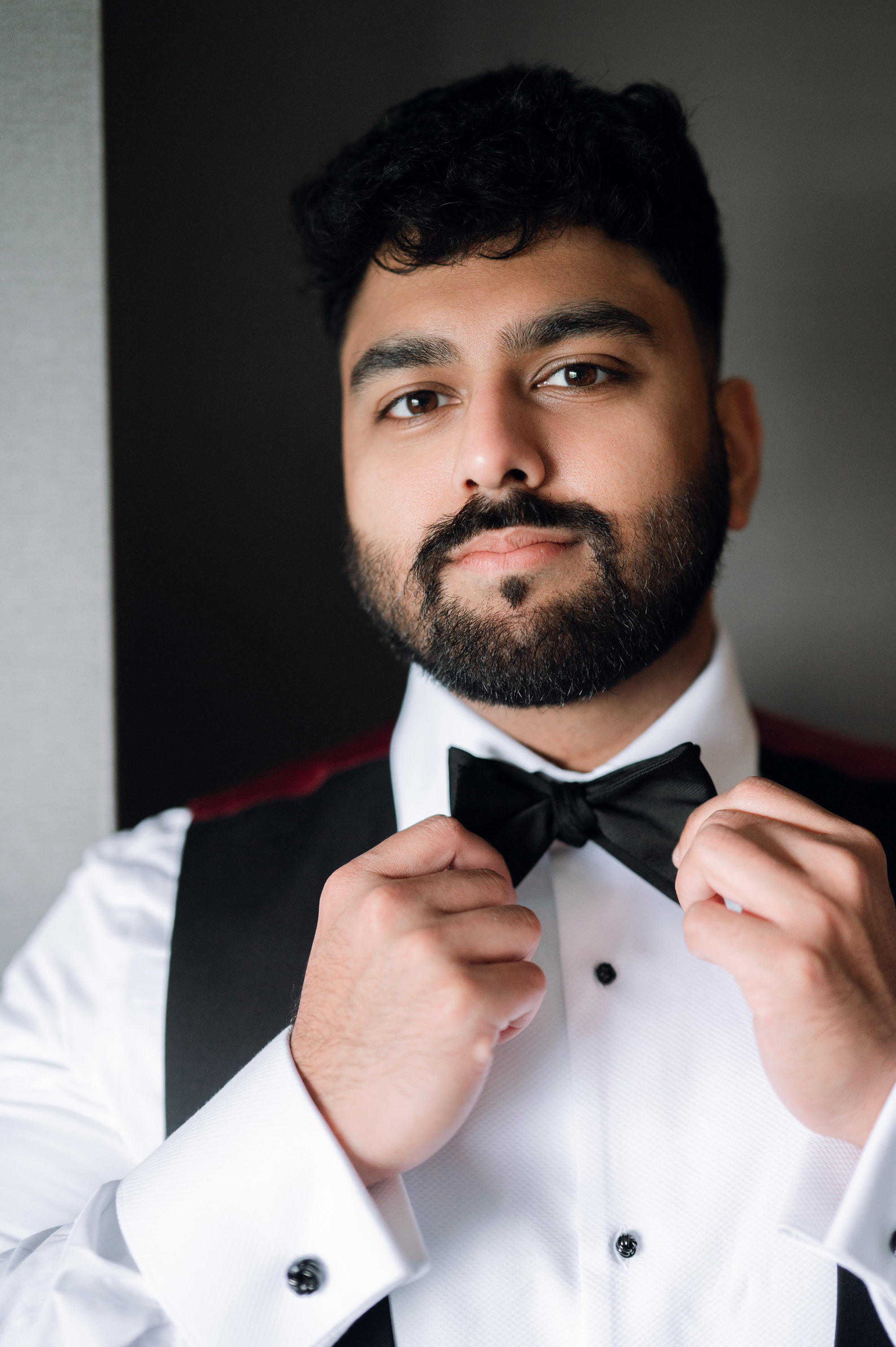 a man with a beard and a bow tie