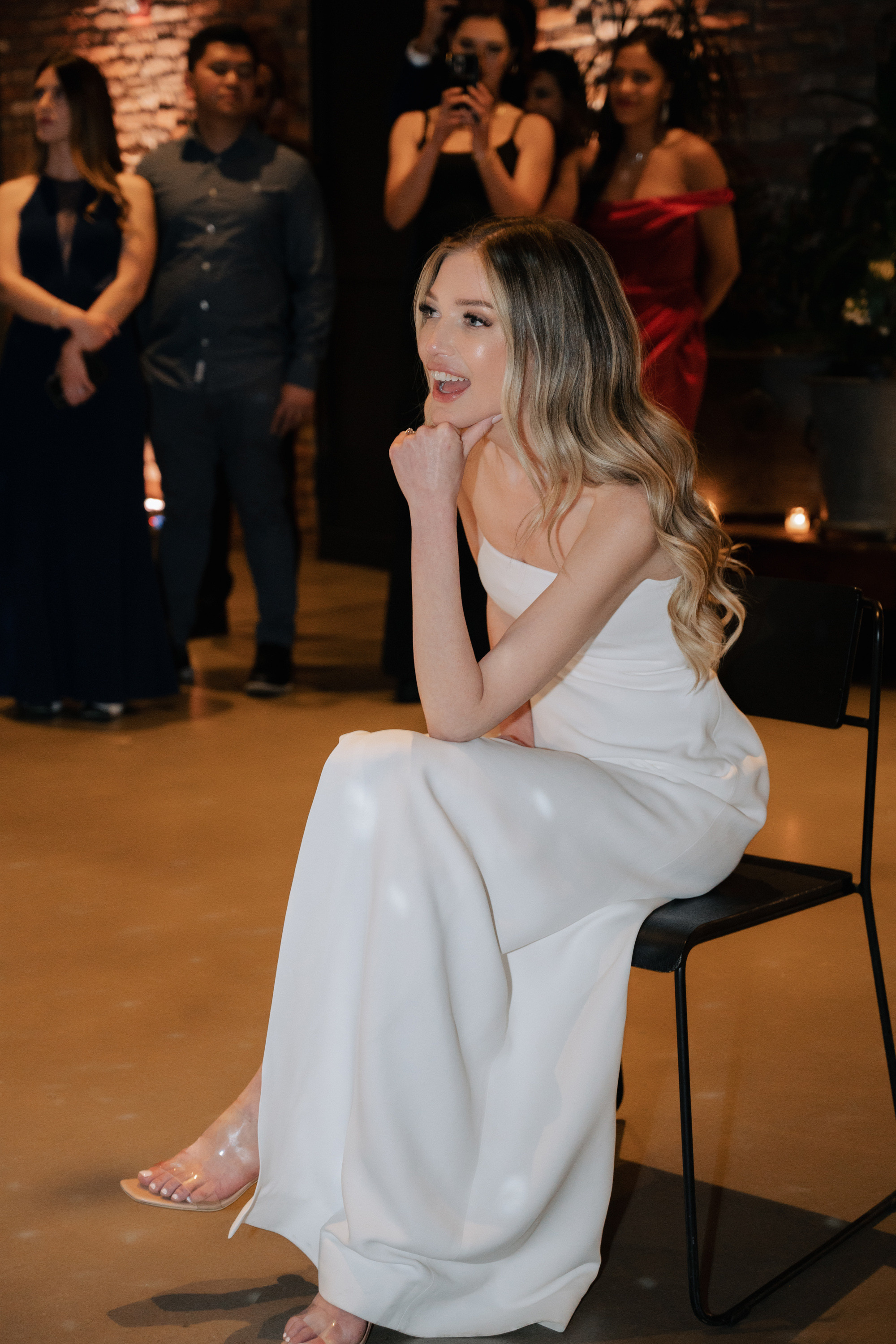 a woman sitting on a chair in a room