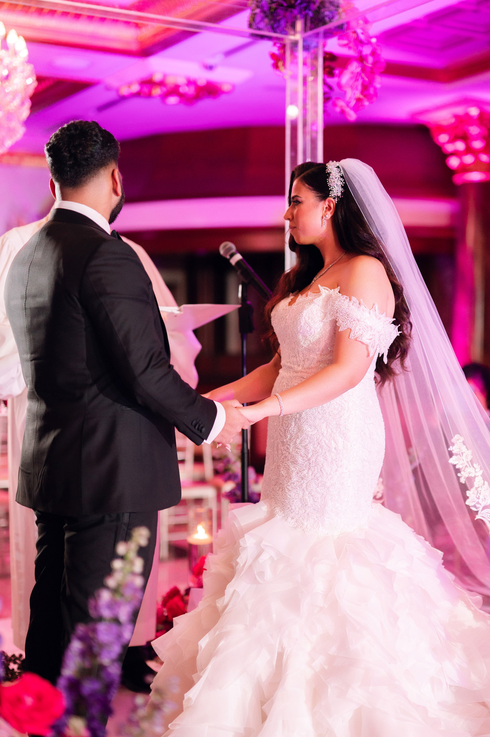 a bride and groom are exchanging during their wedding ceremony