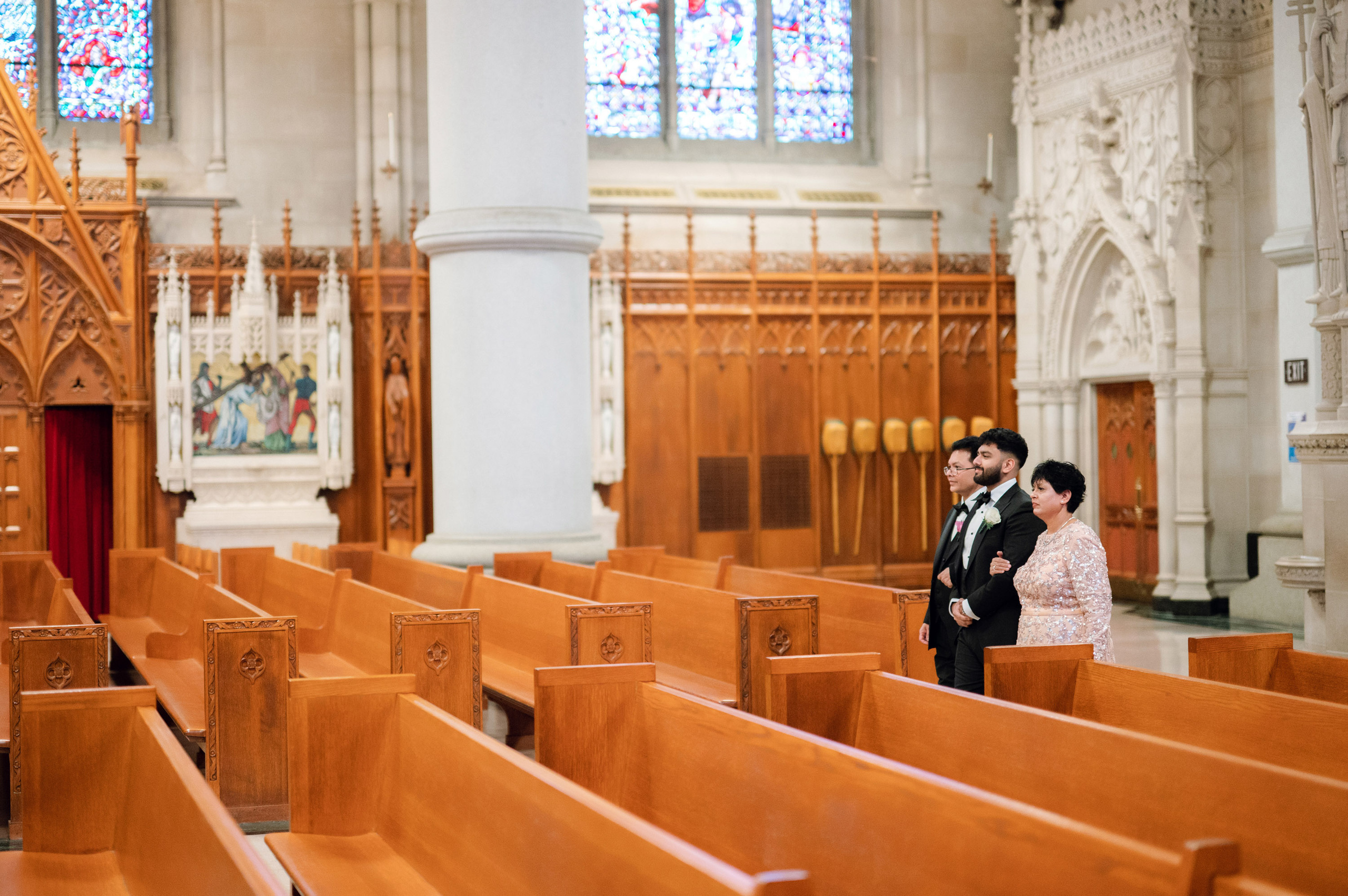 a couple standing in a church looking at each other