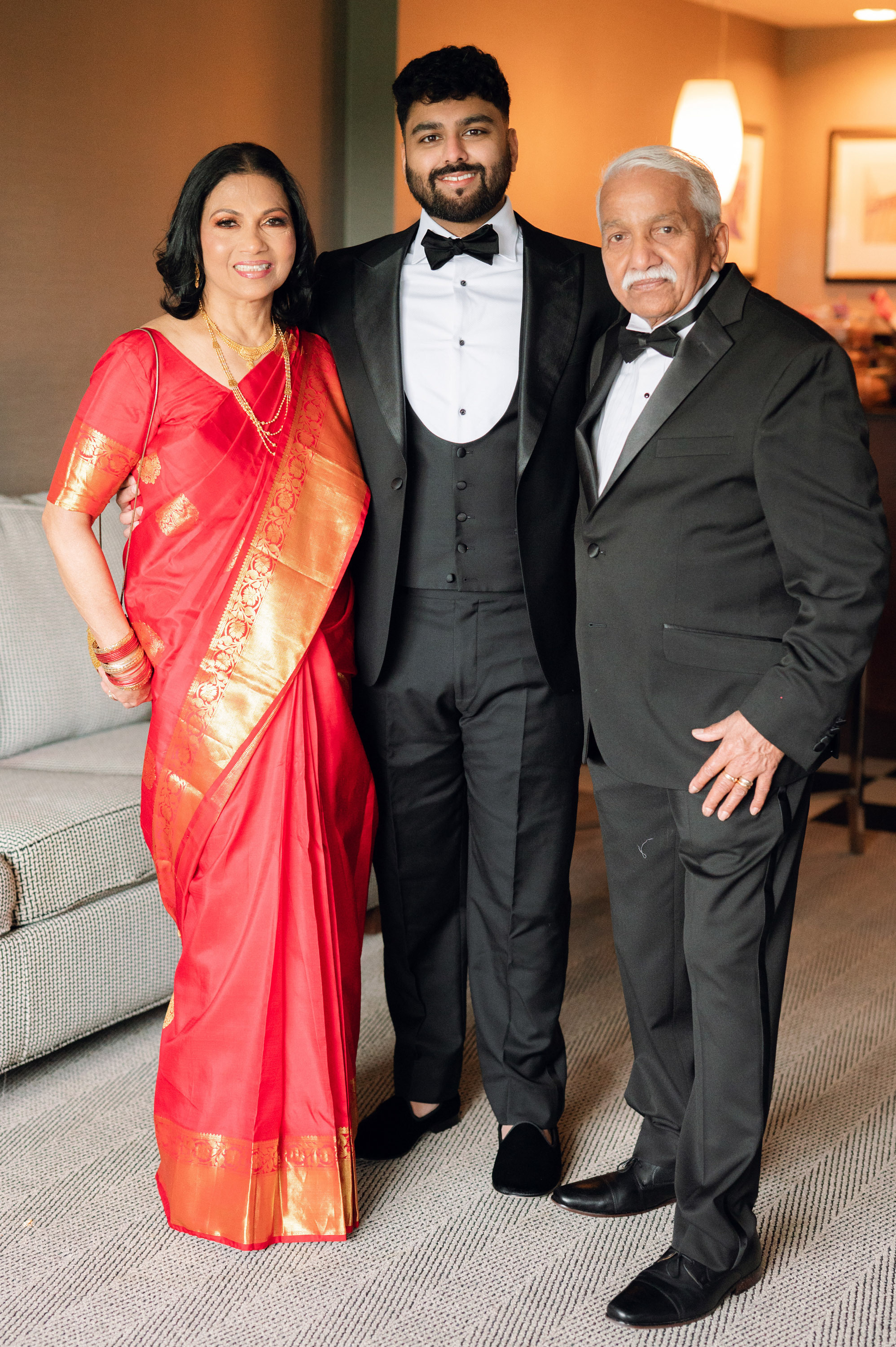 a man and woman in formal attire posing for a picture