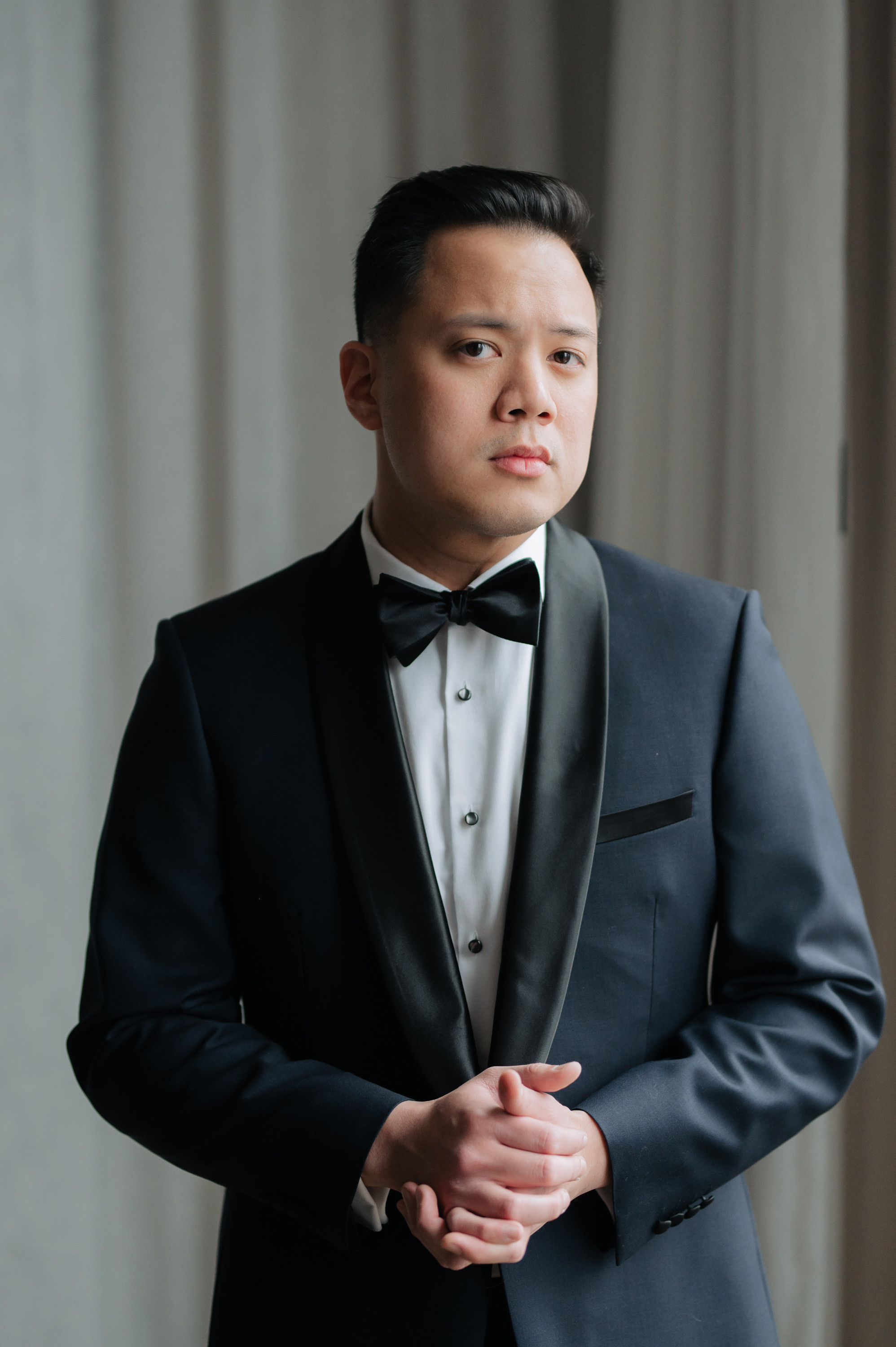 a man in a tuxed suit and bow tie