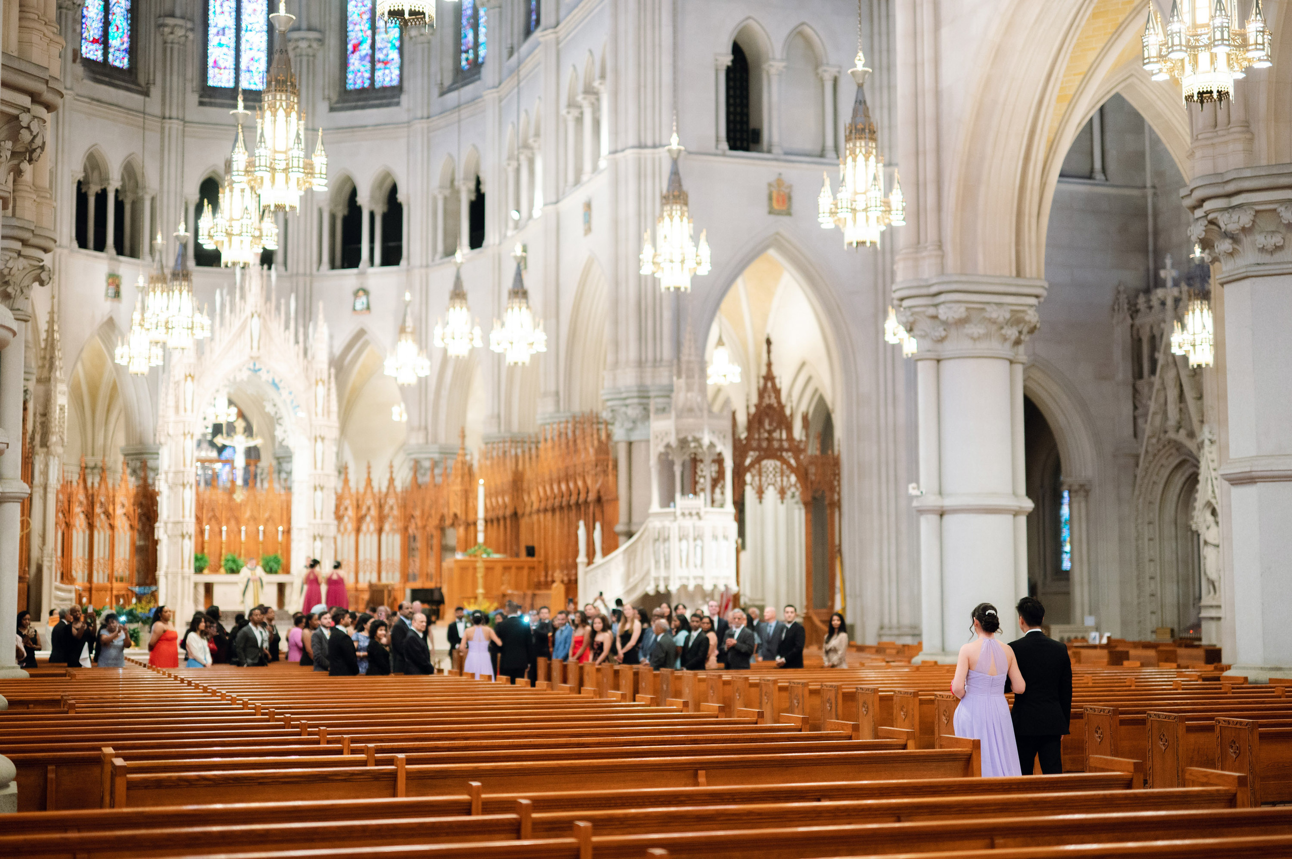 a group of people standing in a church