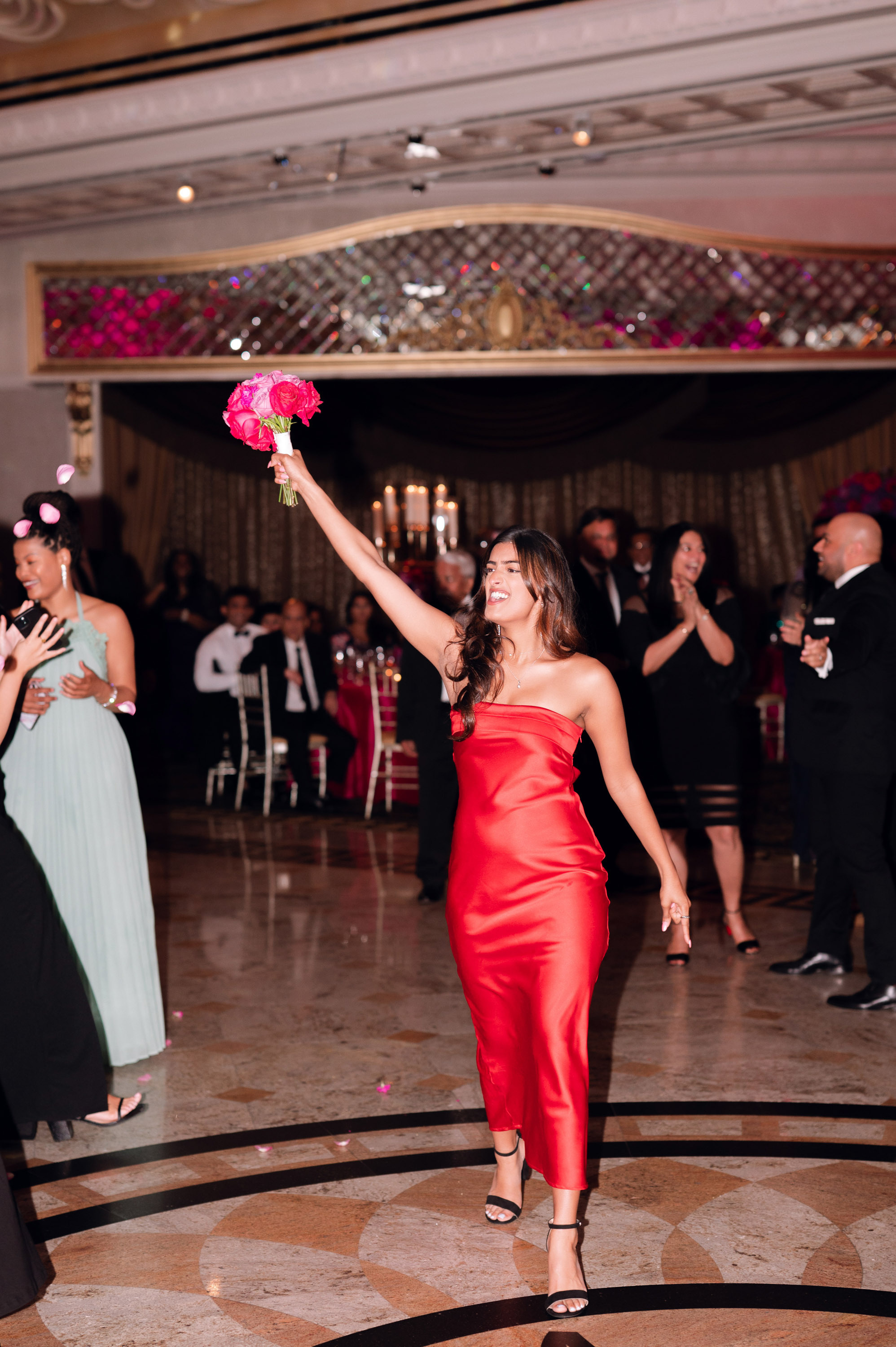 a woman in a red dress is dancing