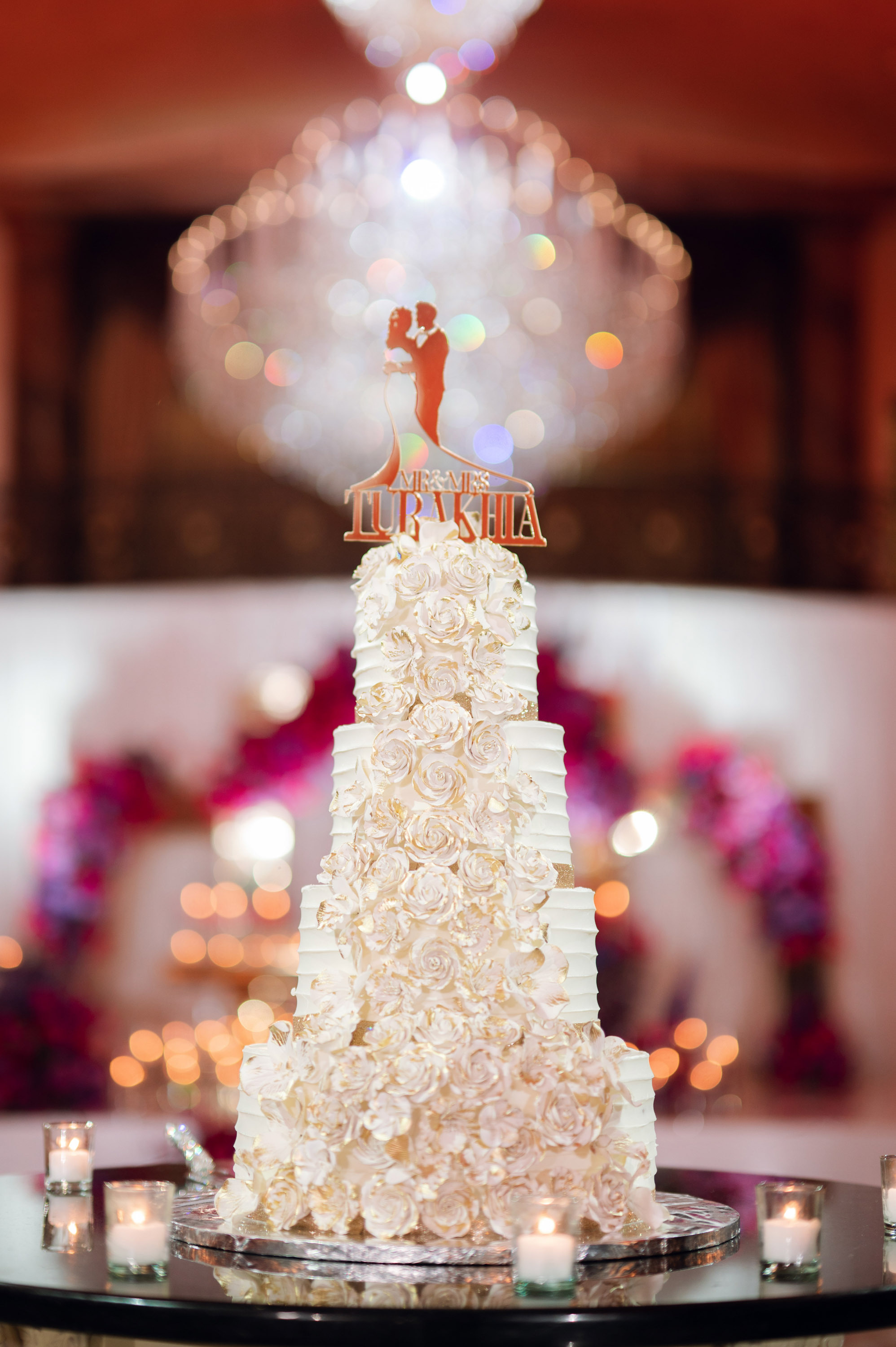 a wedding cake with a bride and groom on top
