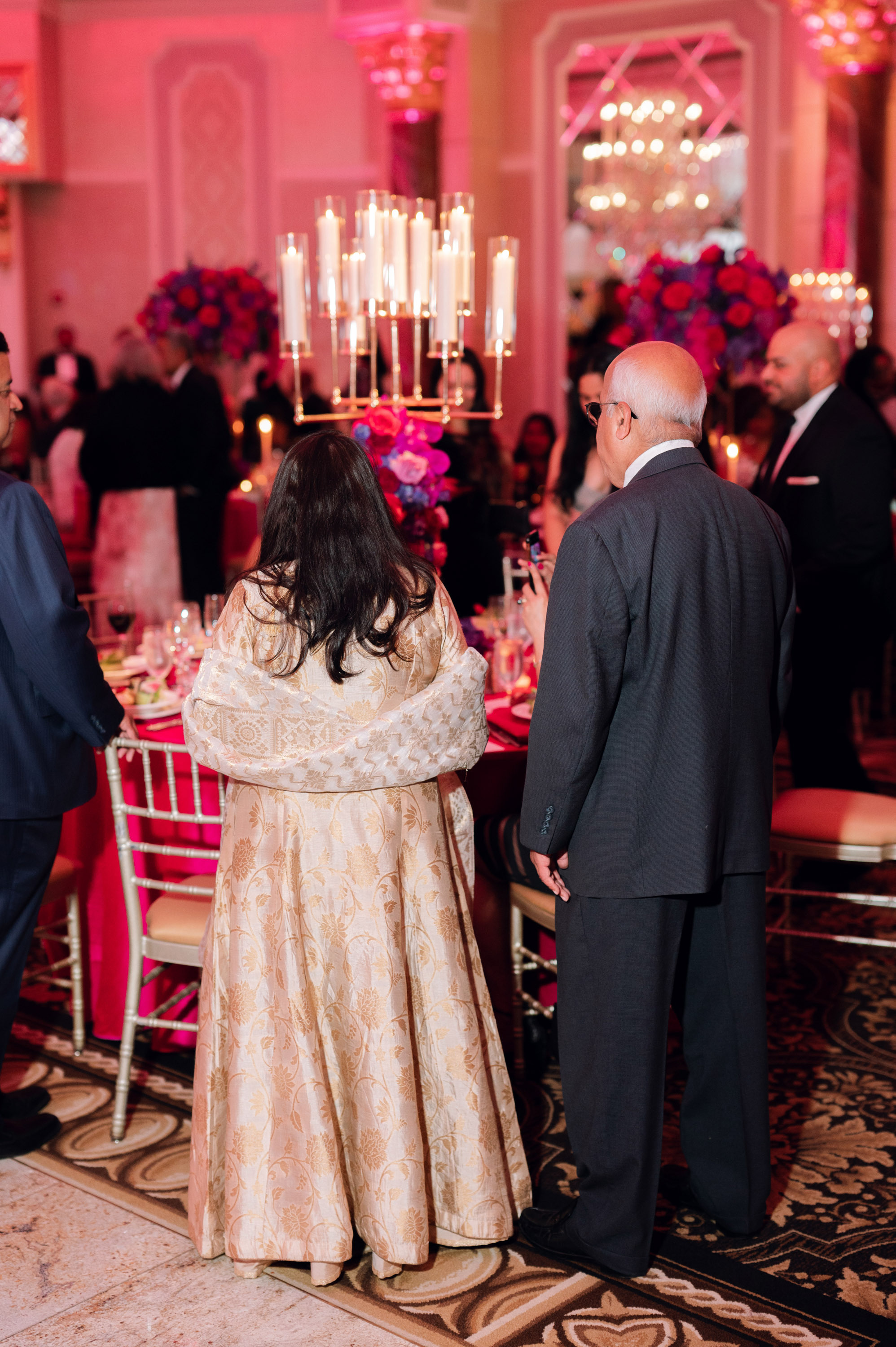 a man and woman standing in a room