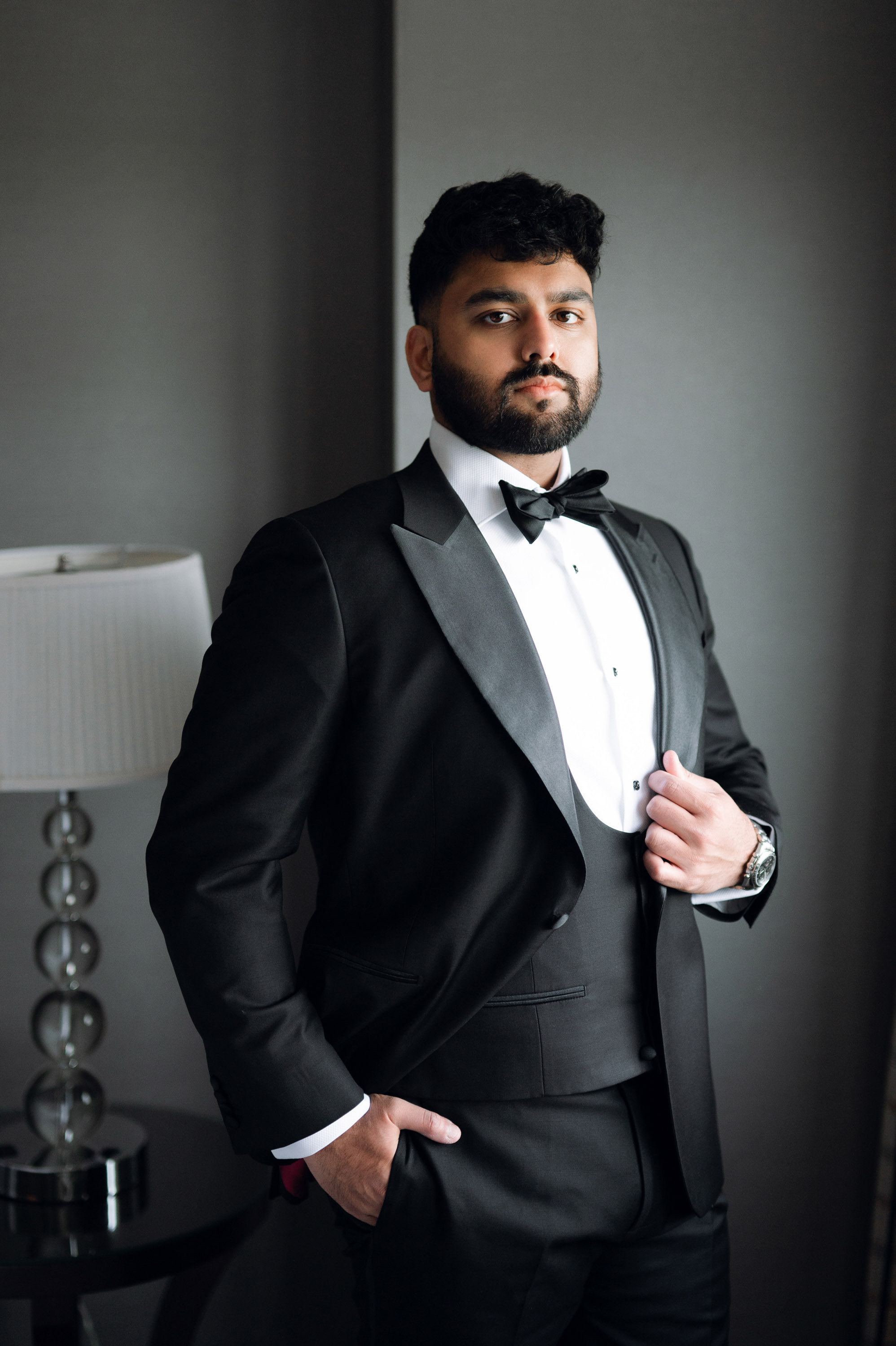 a man in a tuxed suit and bow tie