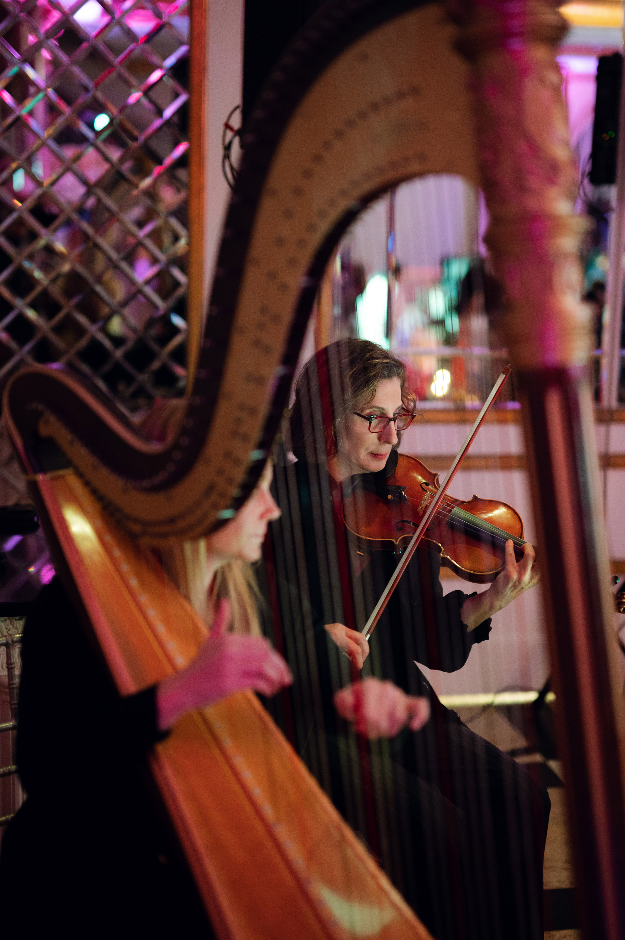a woman playing a violin