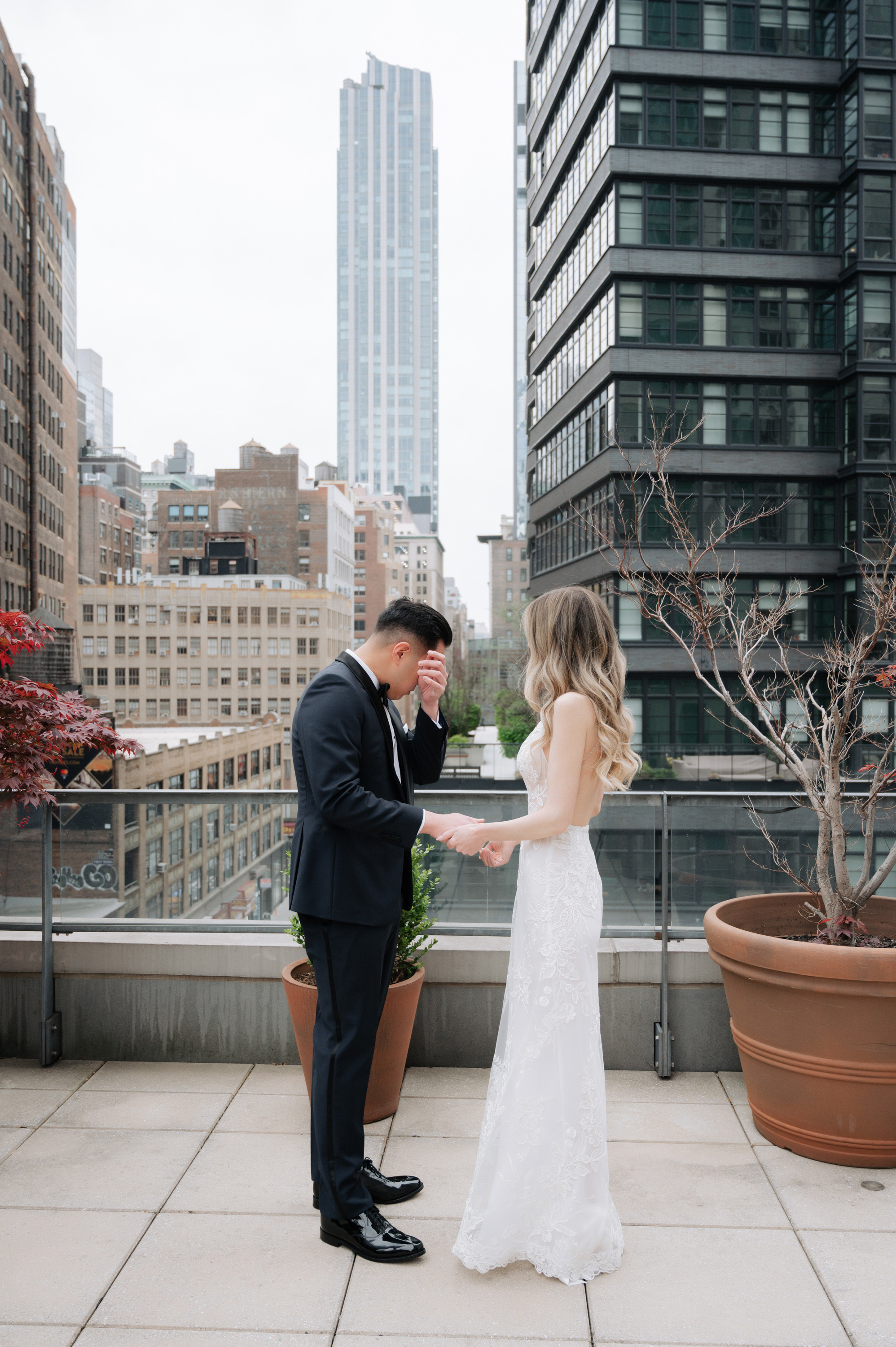 a bride and groom on a rooftop