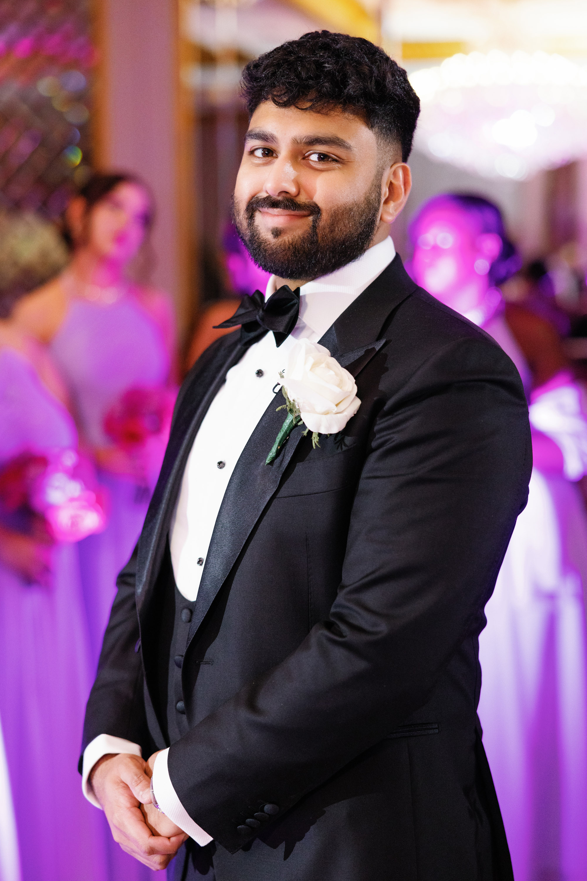 a man in a tuxed suit and bow tie