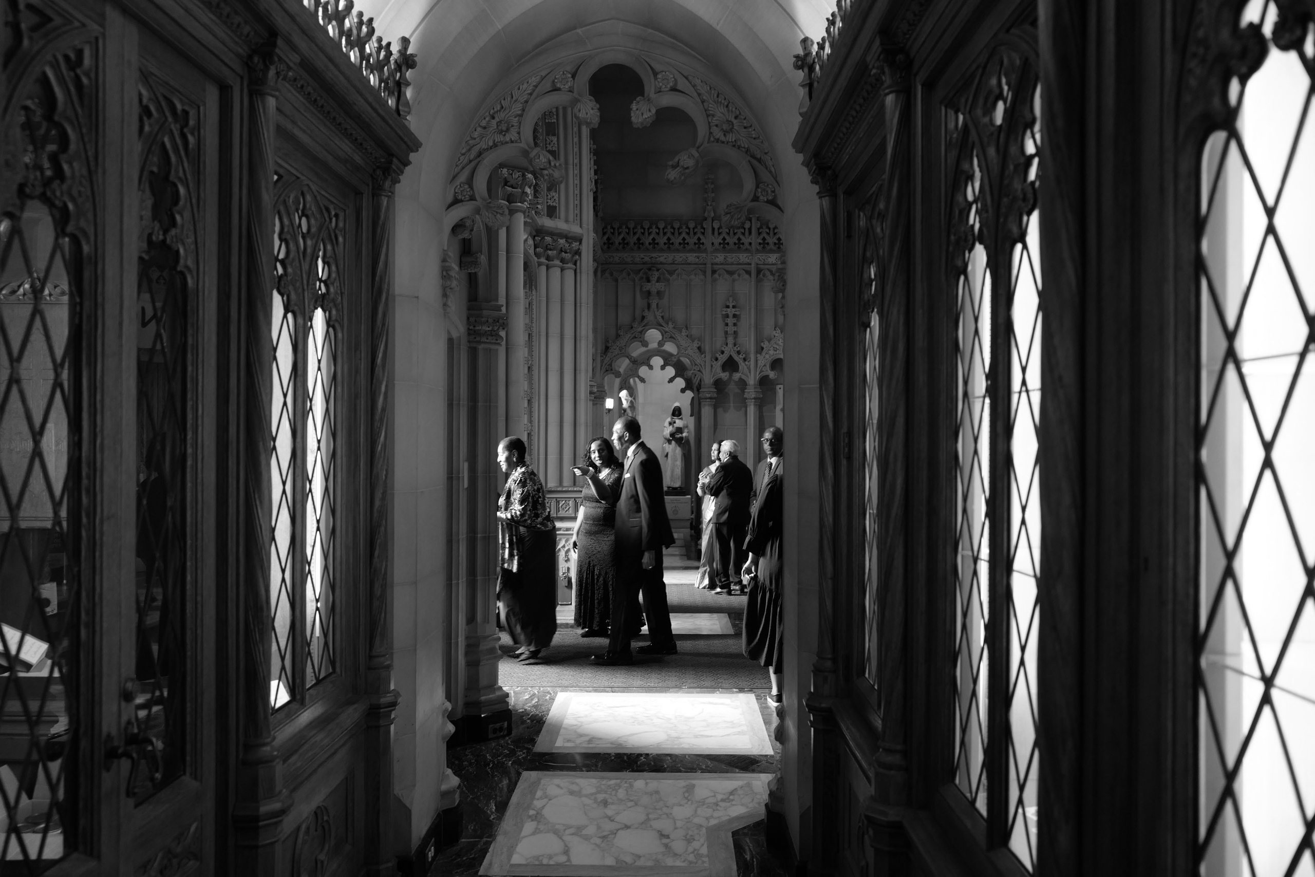 a group of people standing in a hallway